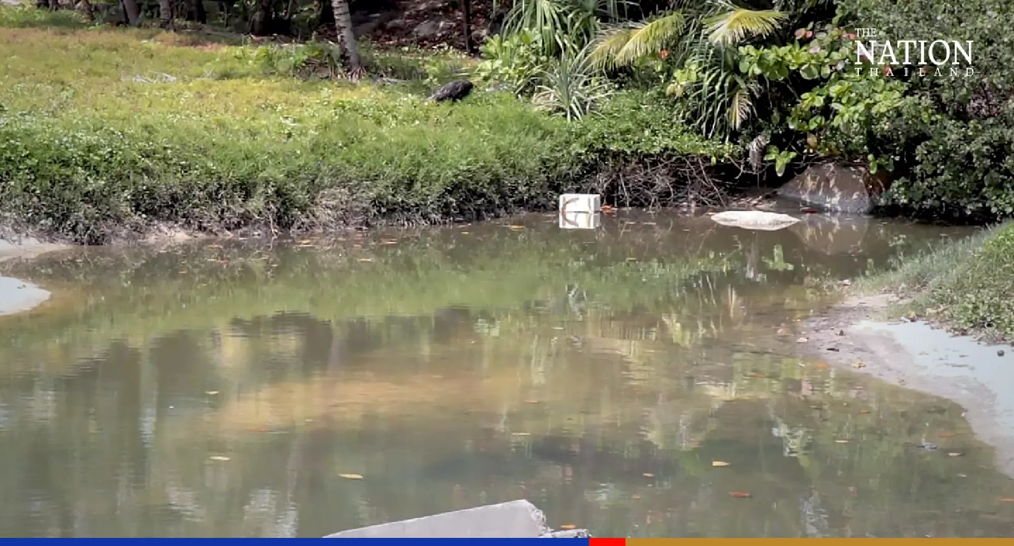 Black, stinky water off Karon beach is only sludge, say Phuket authorities