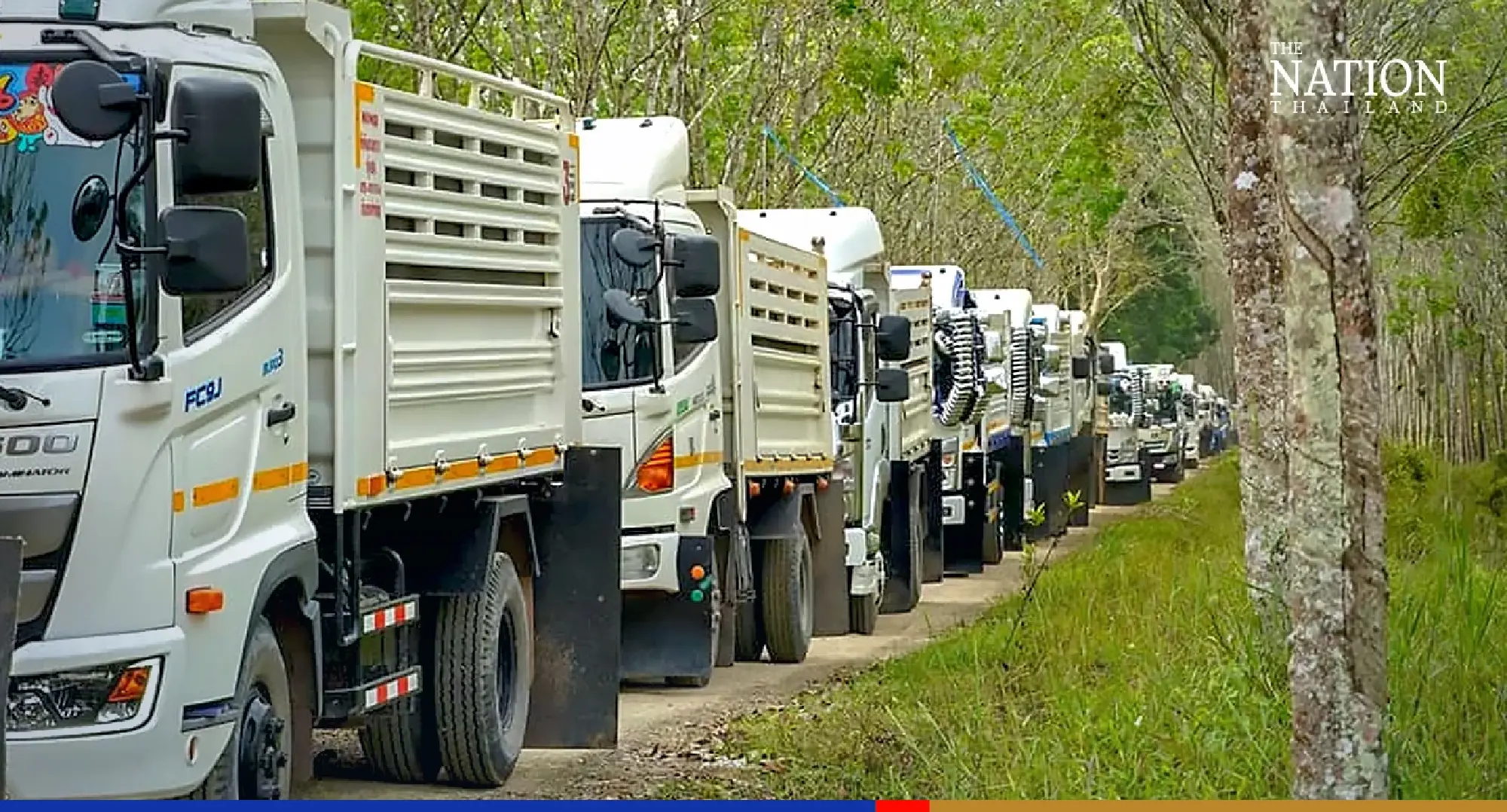 Spiritual truck drivers deliver earth to build temple’s defence against floods