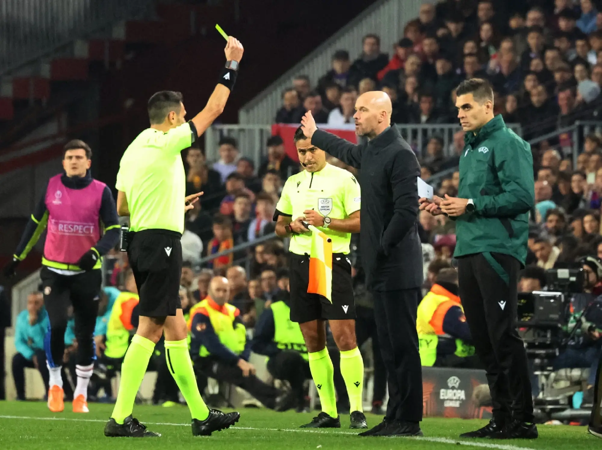  Manchester United manager Erik ten Hag is shown a yellow card by referee Maurizio