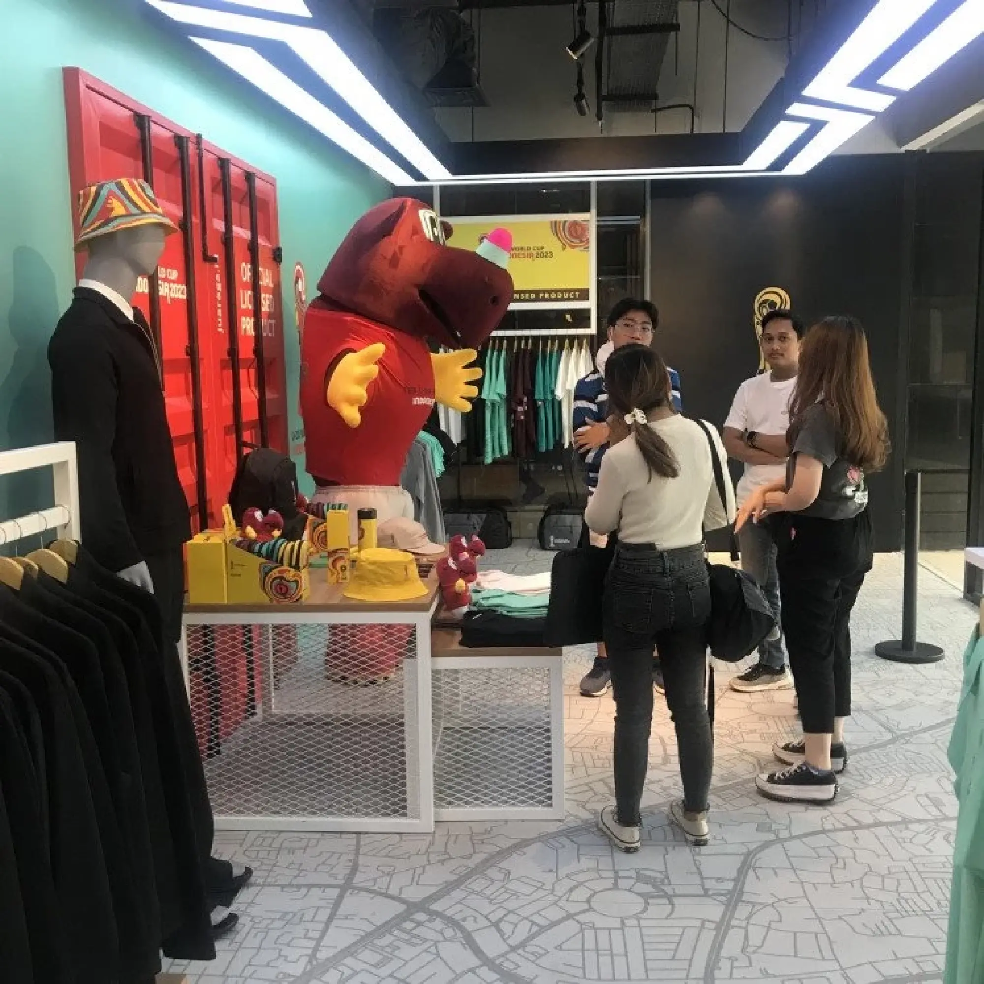 Drawing crowds: A group of customers gathers in front of U-20 World Cup merchandise.