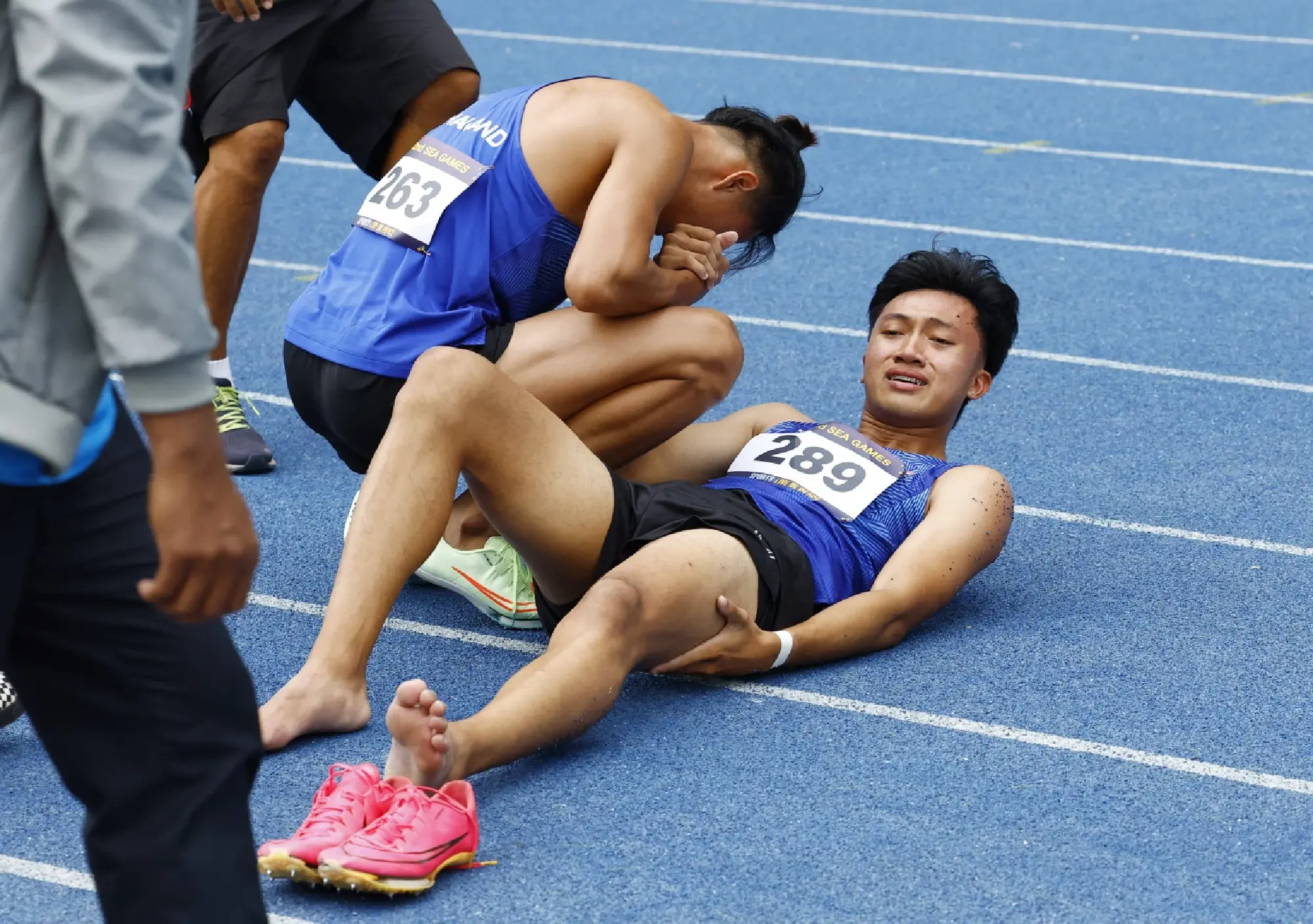 Thailand's Soraoat Dapbang shakes hands with Thailand's Puripol Boonson after the men's 200m final