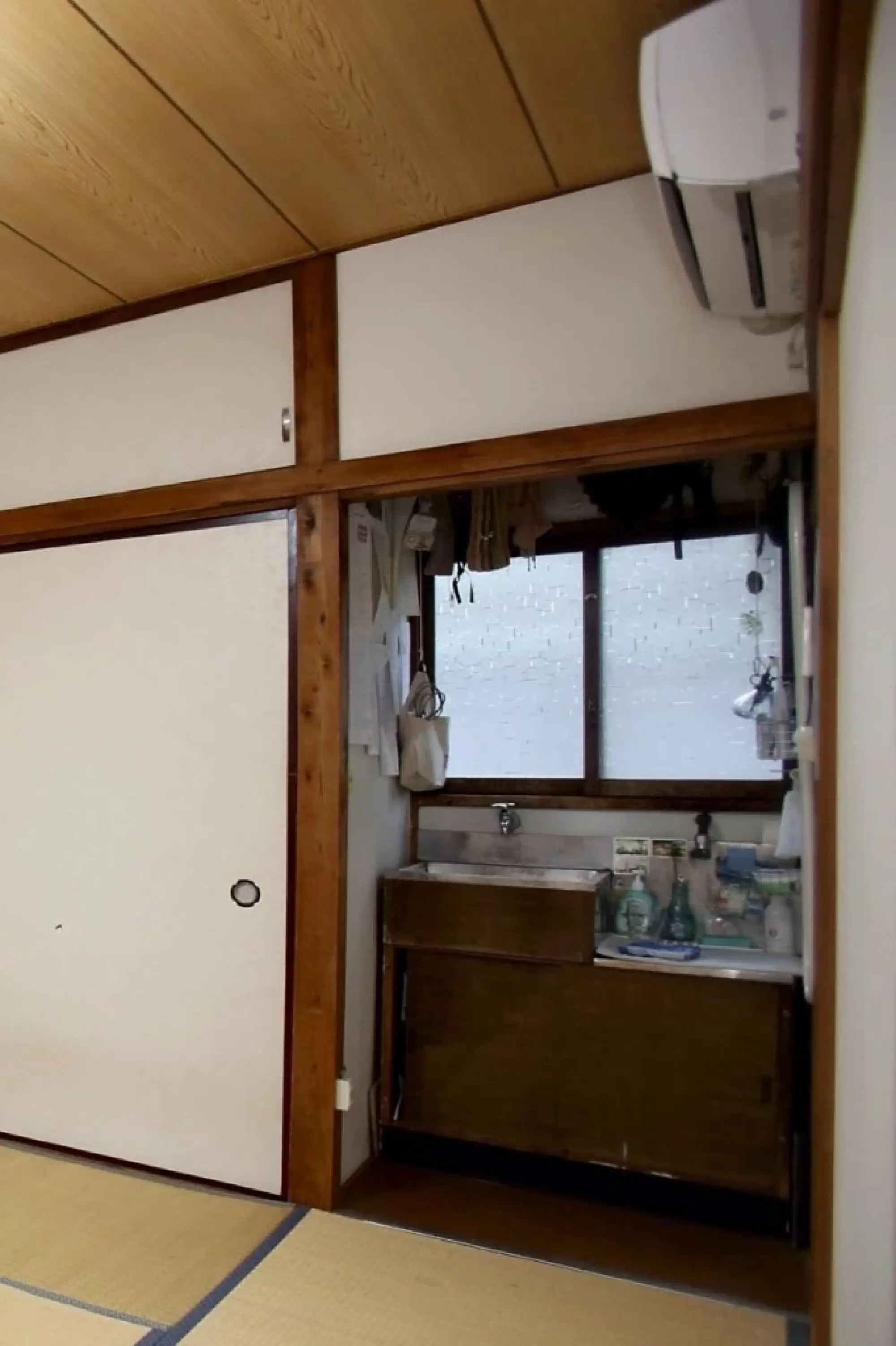 A sink is seen in an NPO employee’s one-room apartment without a bathroom in Tokyo.