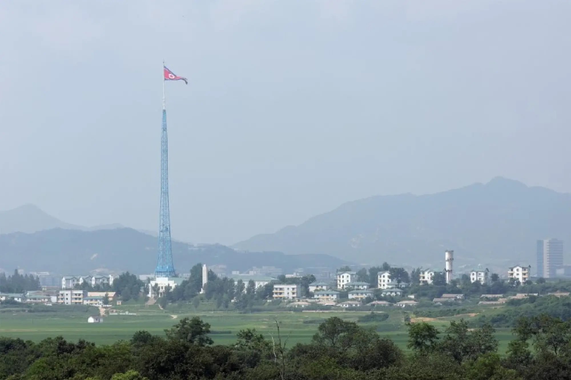 This photo taken from the truce village of Panmunjom in July 2022, shows the landscape of North Korea's Kijong-dong