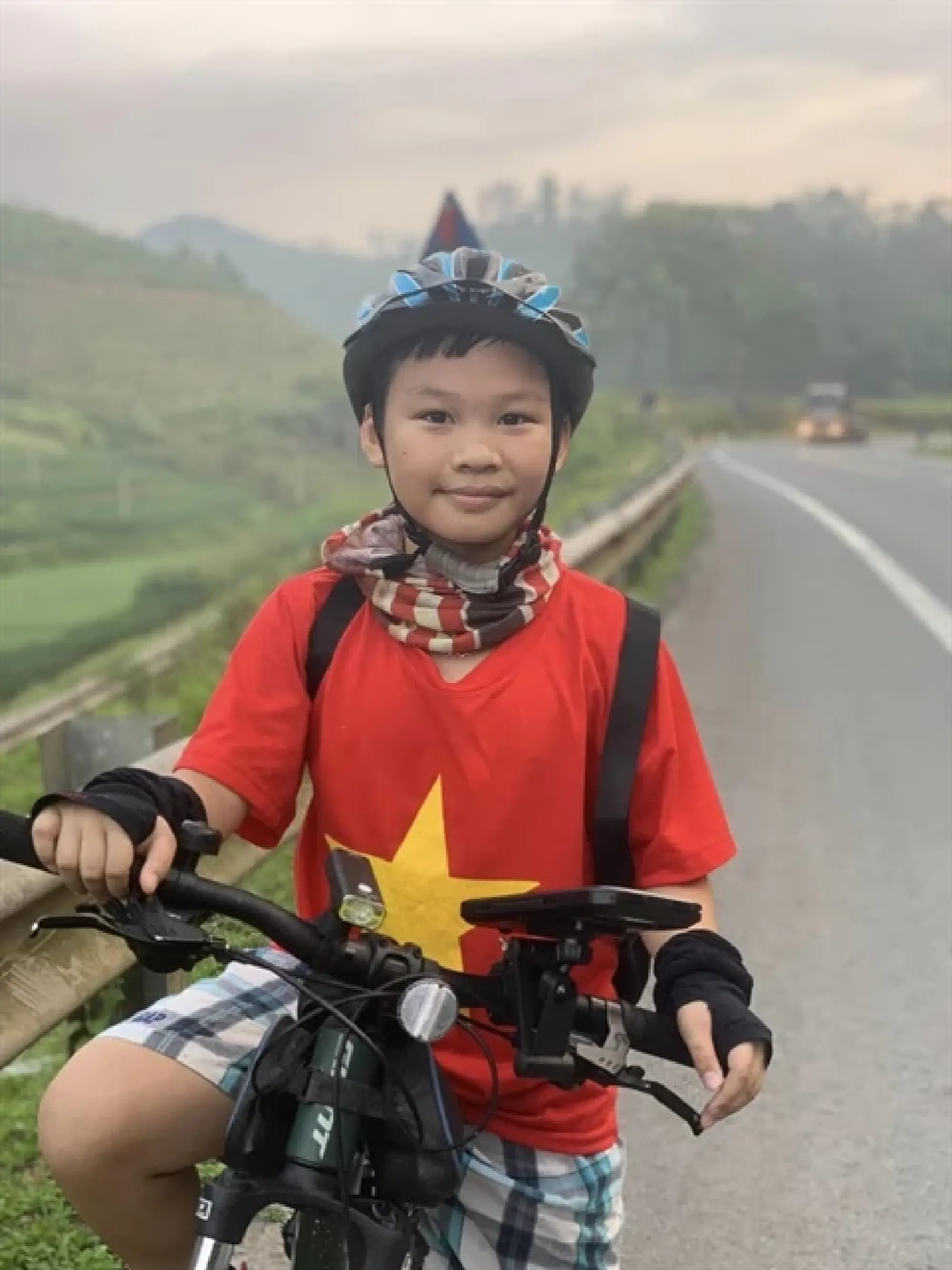 Nông Quang Anh has made two long trips at the age of 10. He biked across Việt Nam in 2022 and travelled around four ASEAN countries in 2023. Photo courtesy of Nông Quang Duy