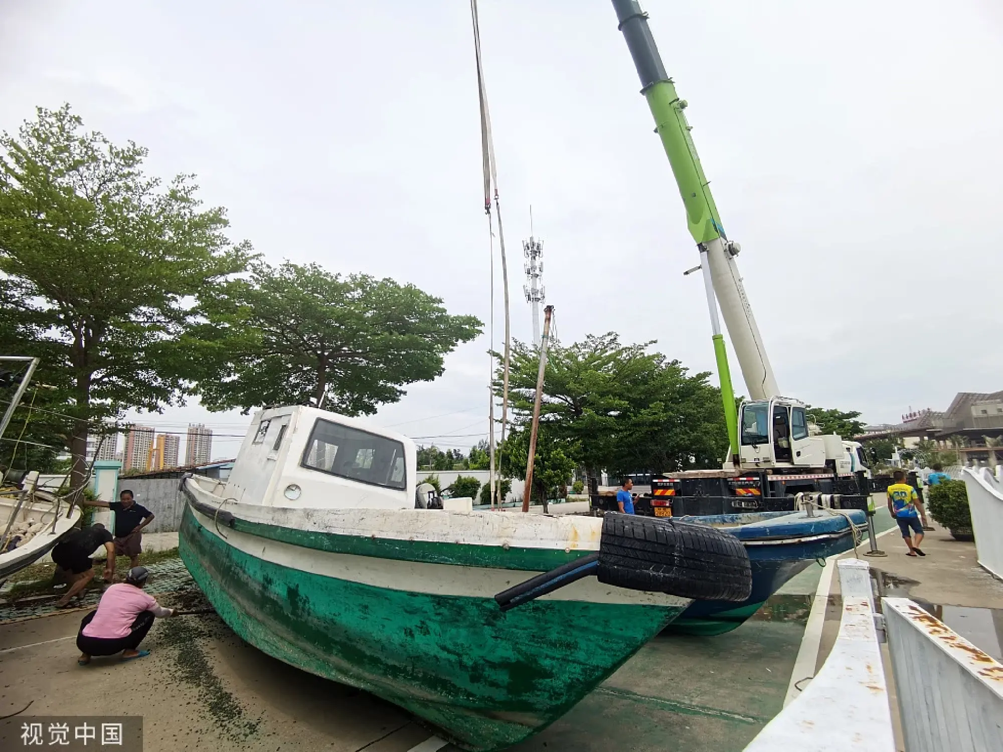 Fishing boats are moved ashore in Beihai, Guangxi Zhuang autonomous region on July 17, 2023 as Typhoon Talim approaches. [Photo/VCG]