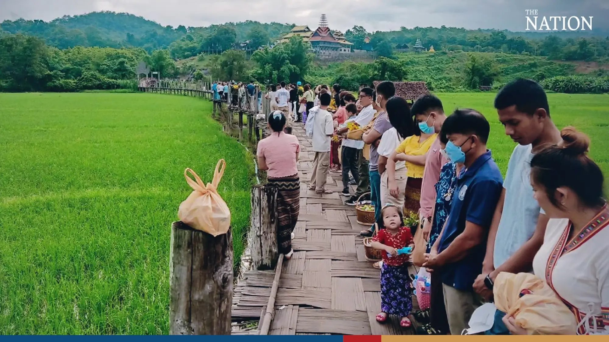 Mae Hong Son bamboo bridge holds strong as devotees give alms to mark Buddhist Lent