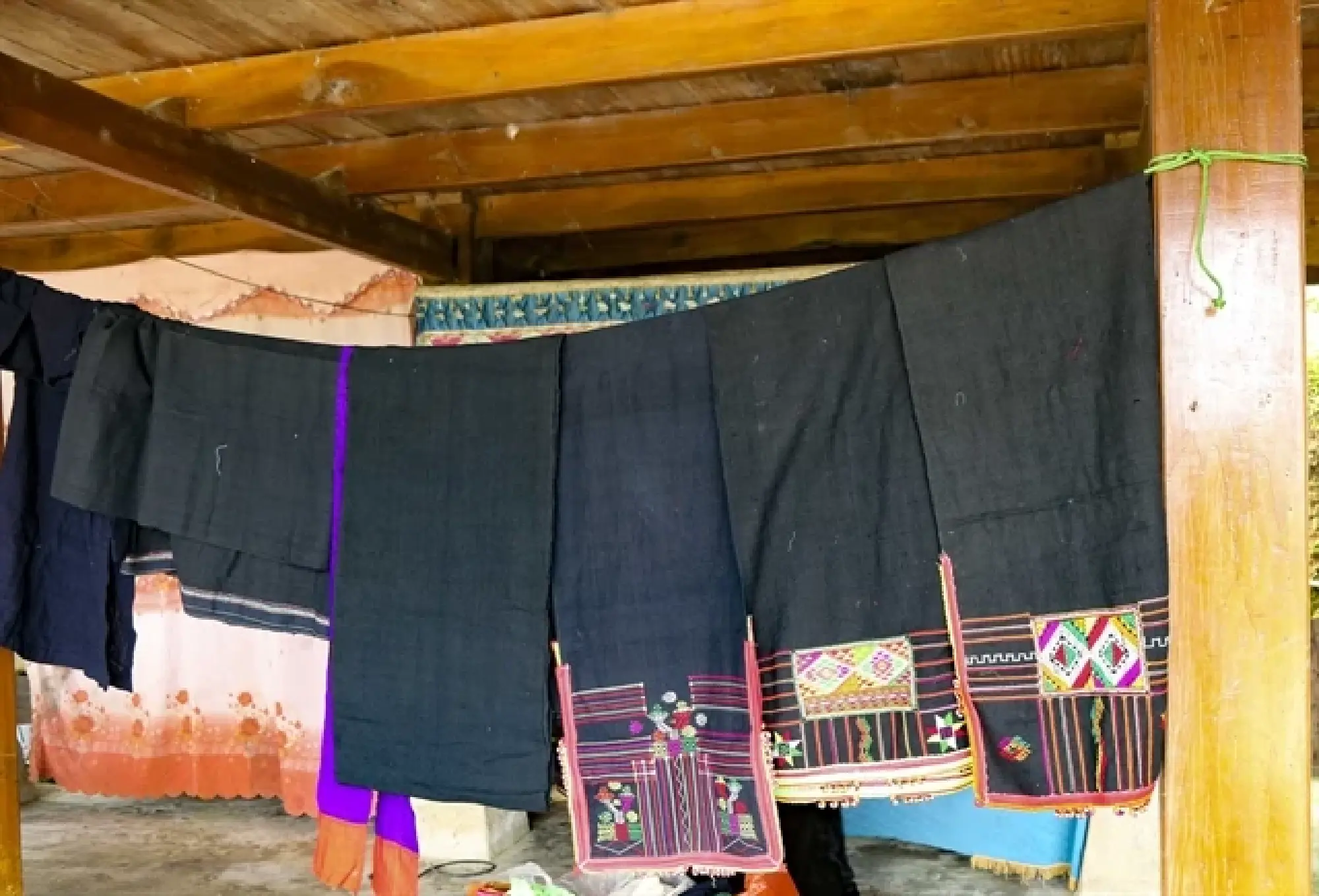 The scarves after being dyed are embroidered with different colours and patterns.