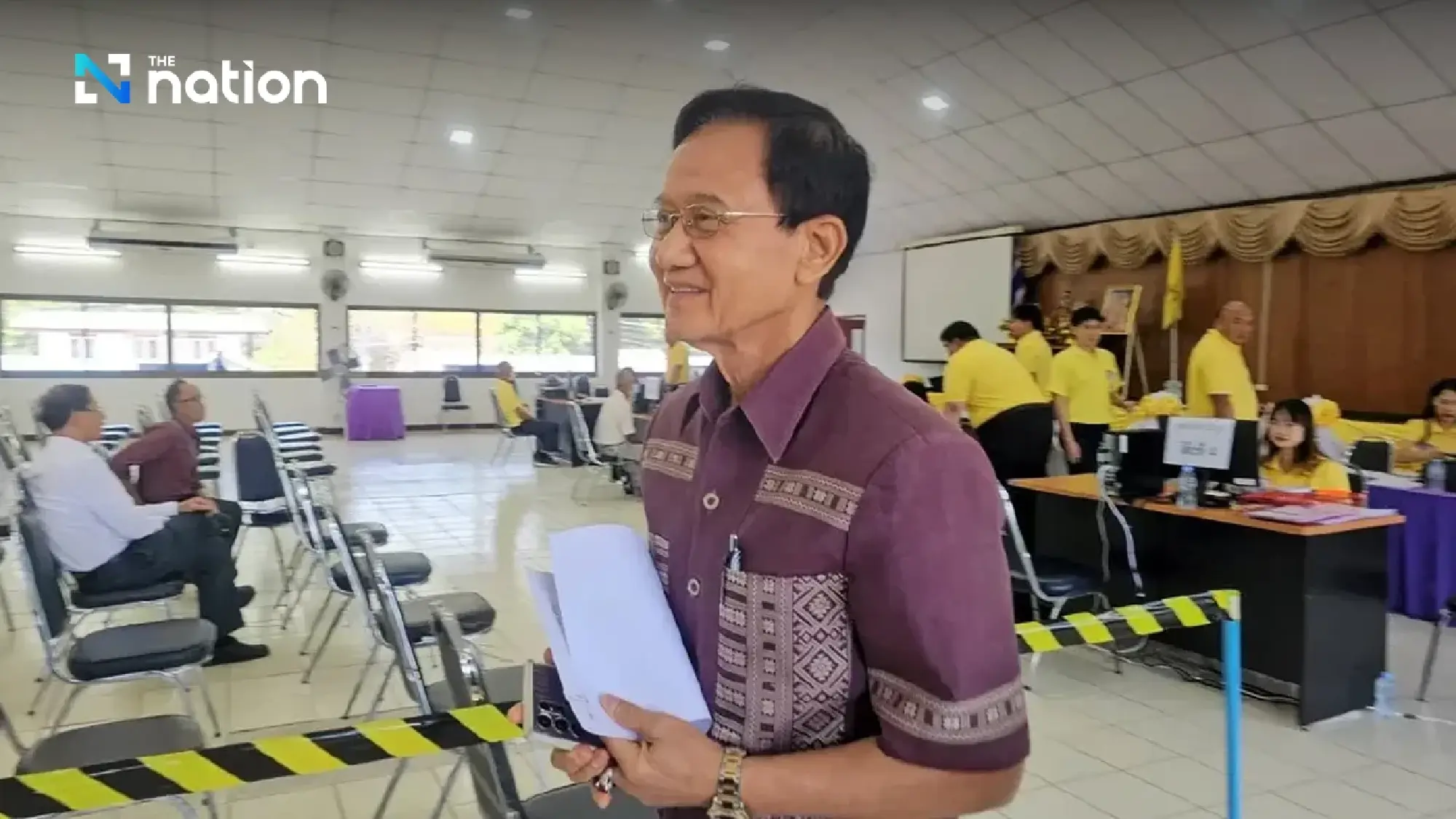 Former prime minister Somchai Wongsawat submits his Senate poll application in Chiang Mai on Monday.