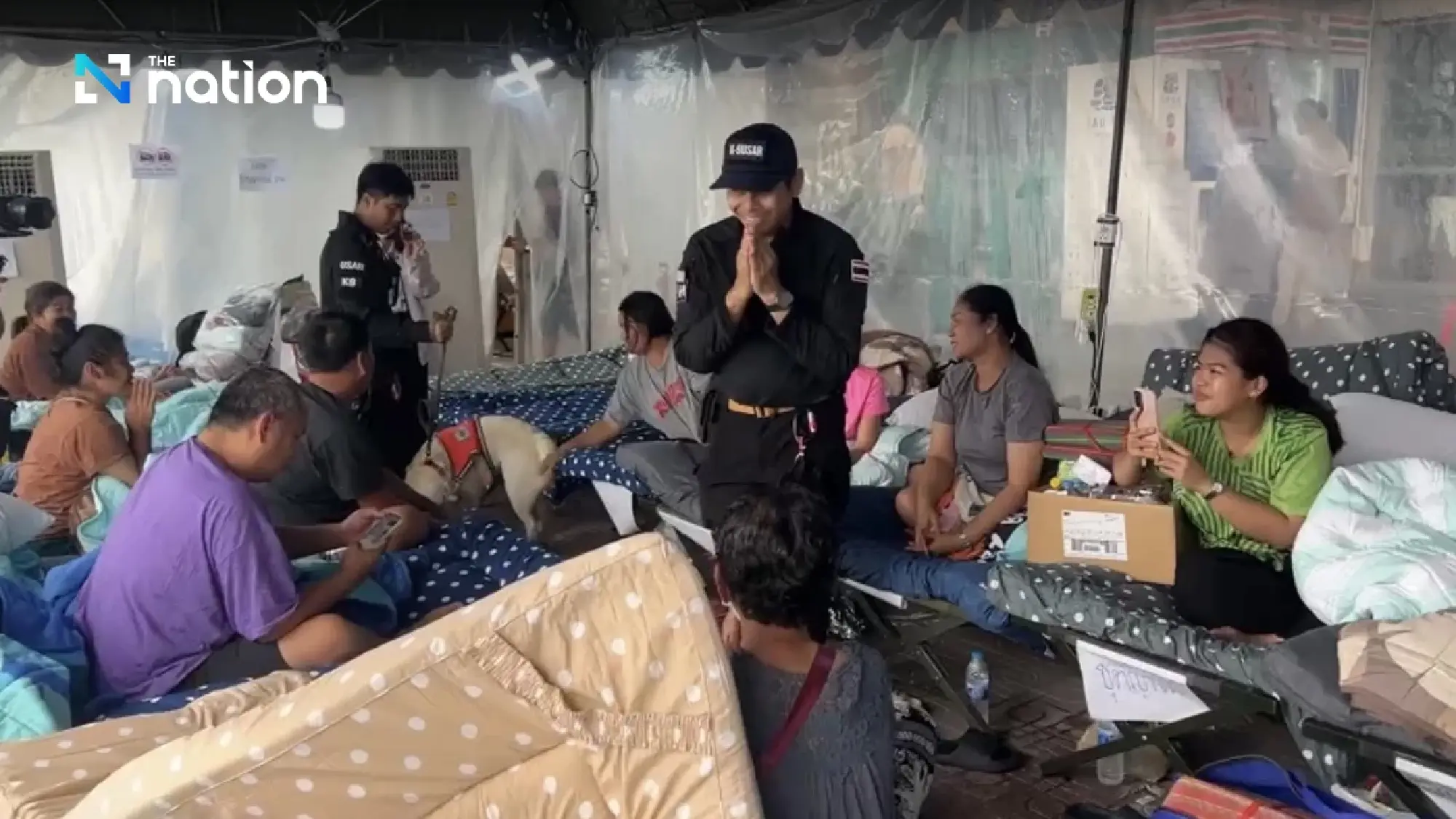 K9 team bids farewell to families of collapsed building’s victims