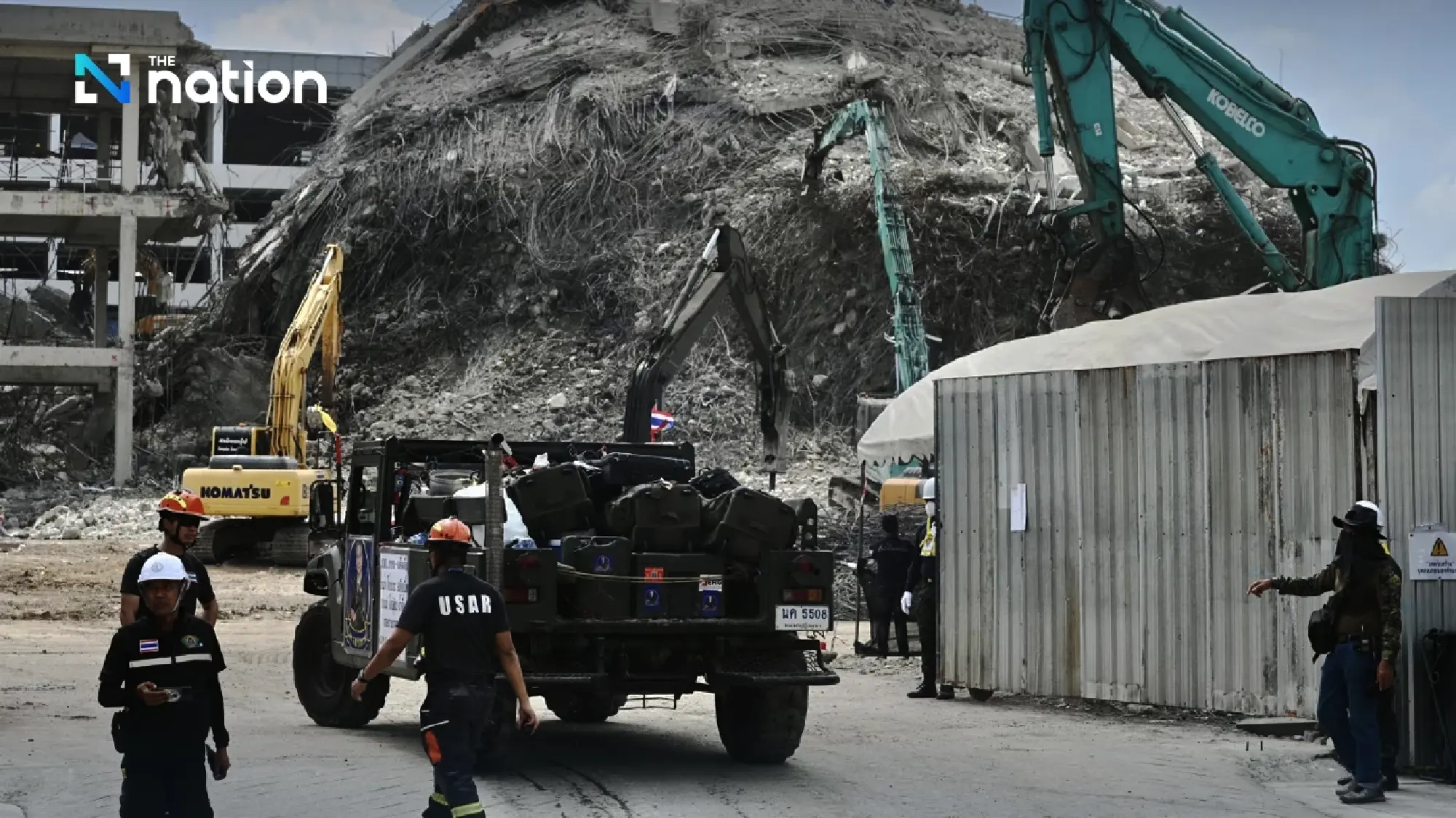 Two more workers' bodies found in collapsed building, more expected tonight