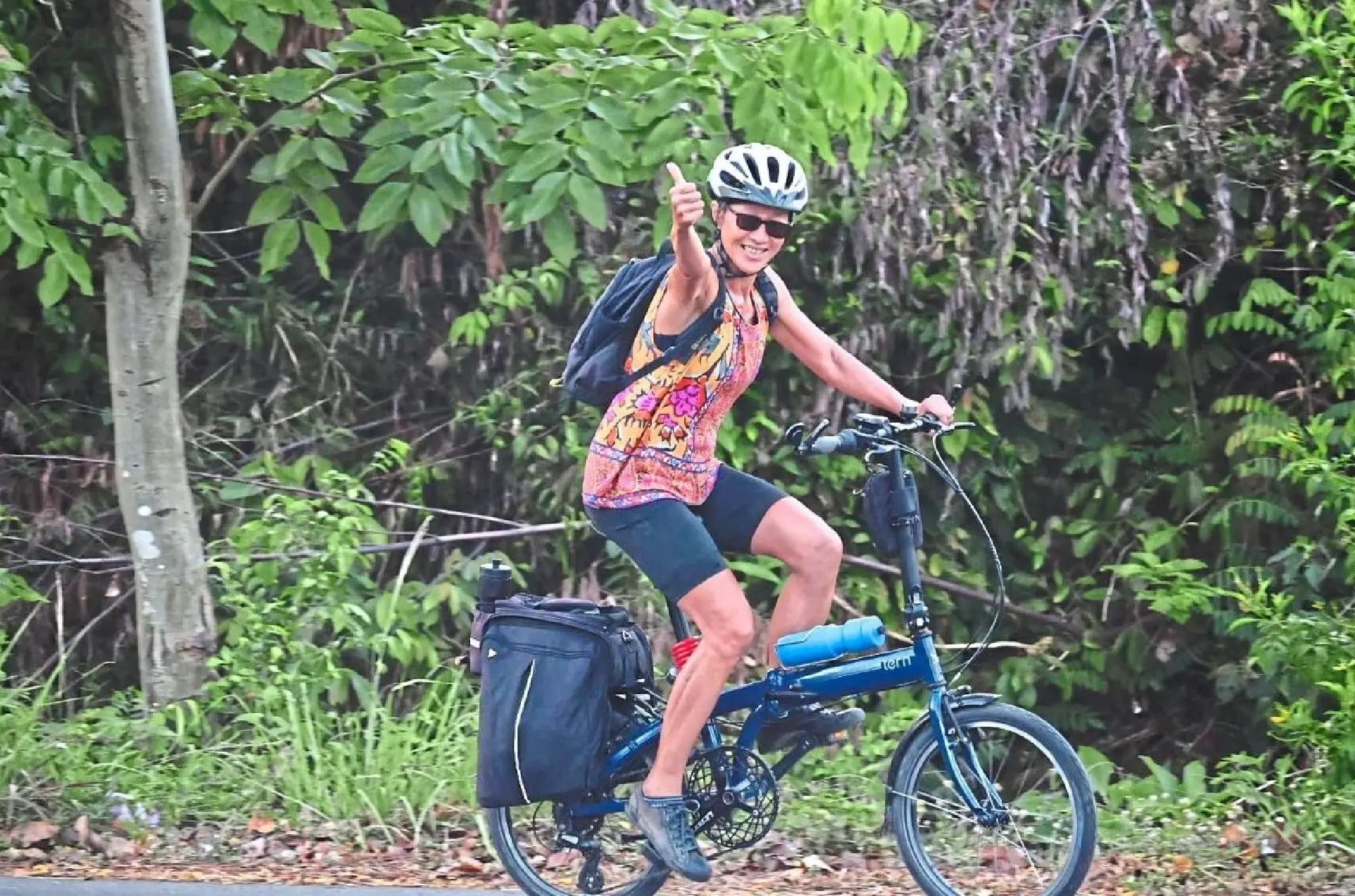 A happy rider working her way uphill towards Pak Khlong from Ban Thale Noi.