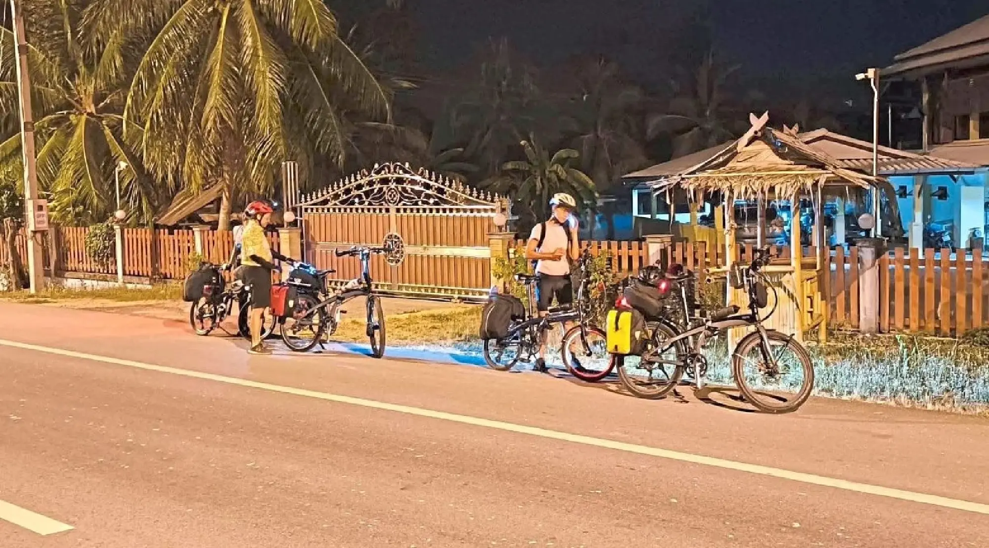 Cyclists rolling out in the wee hours of the morning.