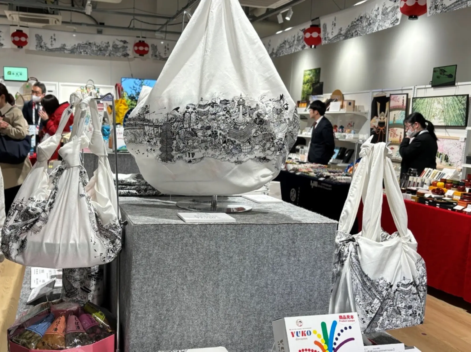 Traditional "furoshiki" wrapping cloths on display at the Okoshiyasu Kyonokomichi Kyoto souvenir shop at the Osaka Expo