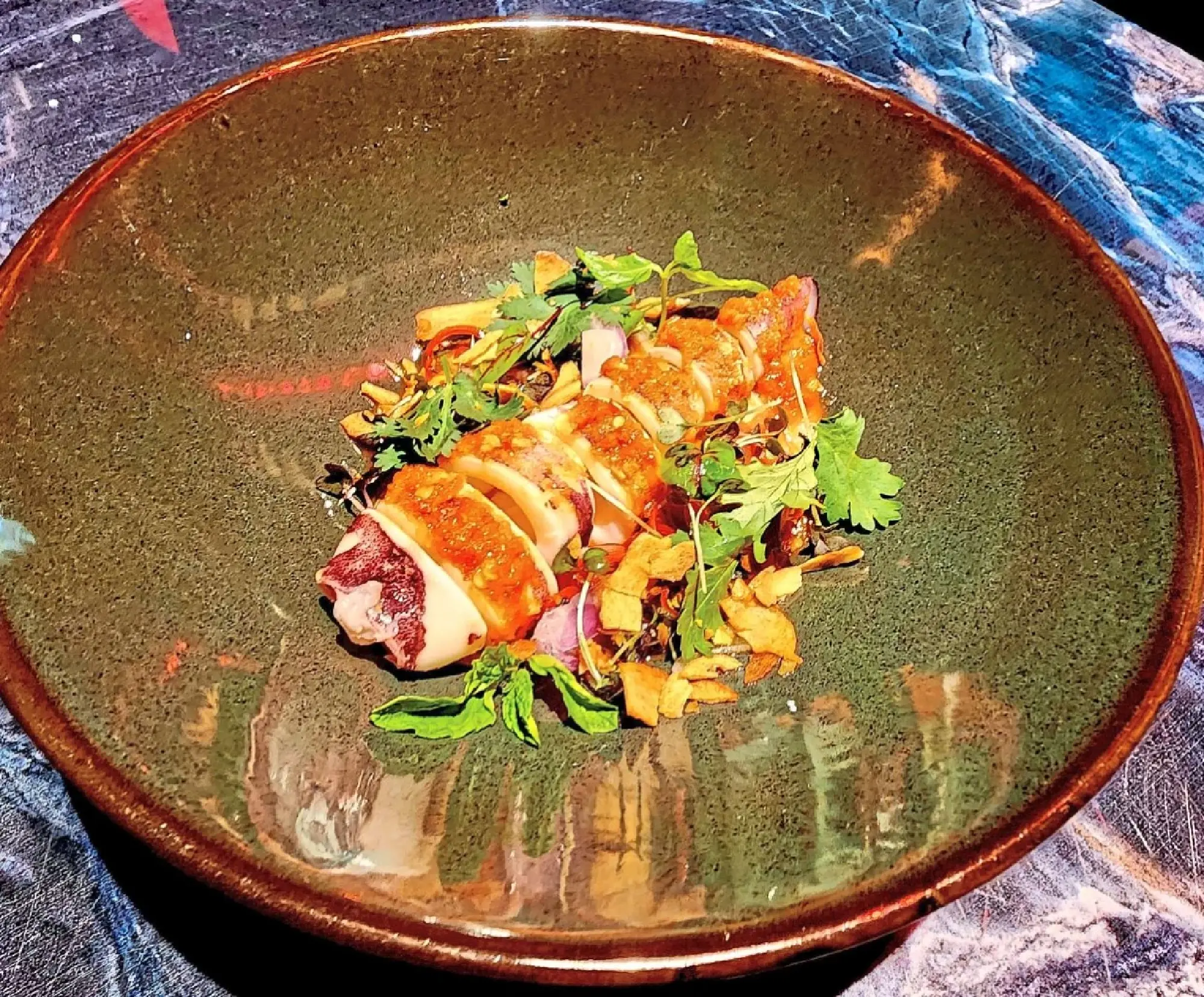 Expect a ride to fiery town with the steamed squid with red sauce.