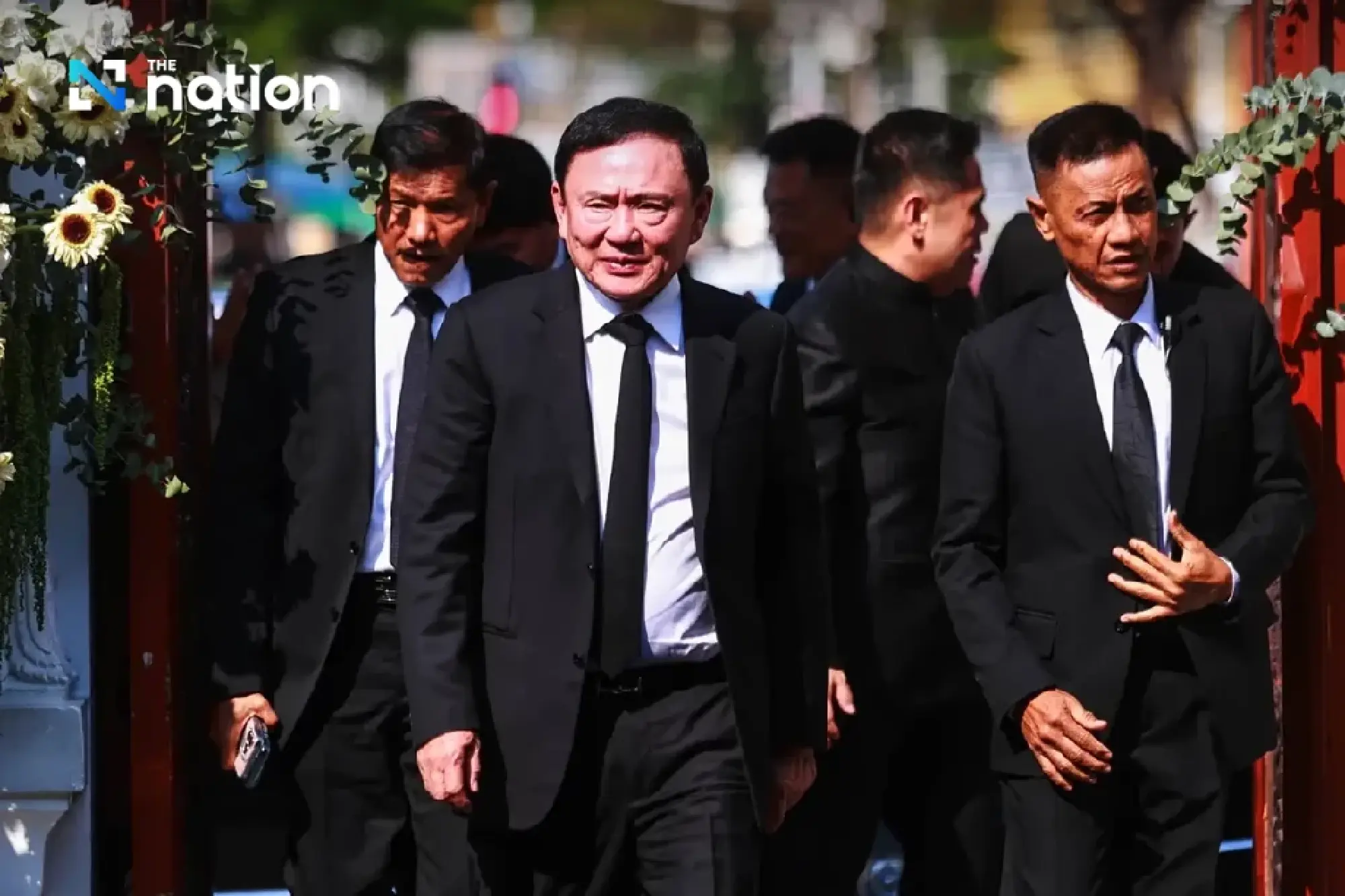 Thaksin remains calm on first day of prosecution hearings in lèse majesté case