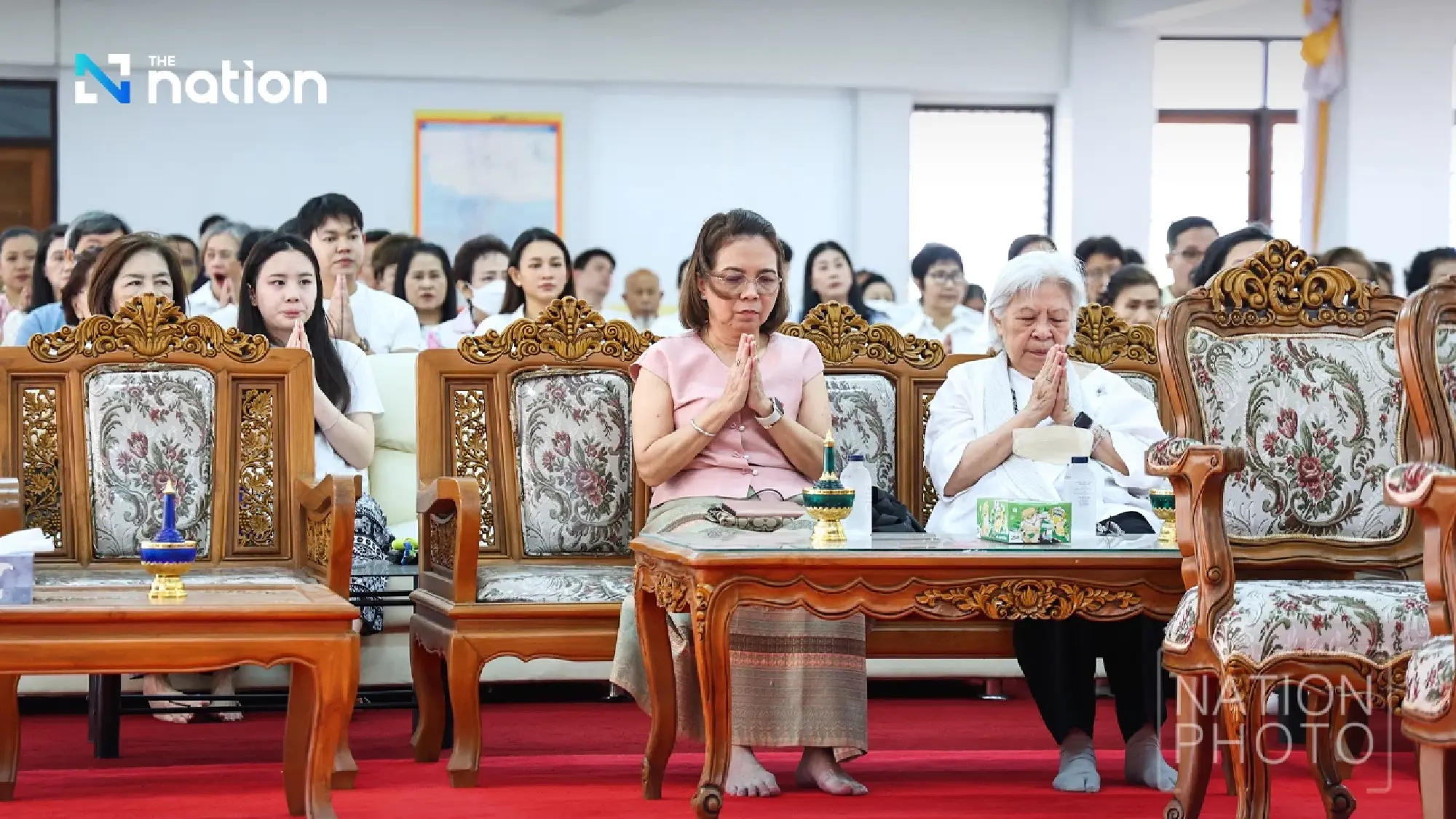 Shine Bunnag leads Nation Group executives in robe offering ceremony