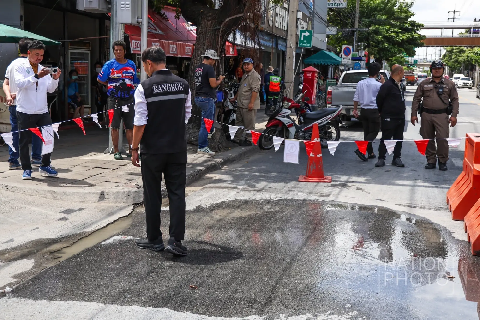 Water seeping from Samsen Road near collapse site