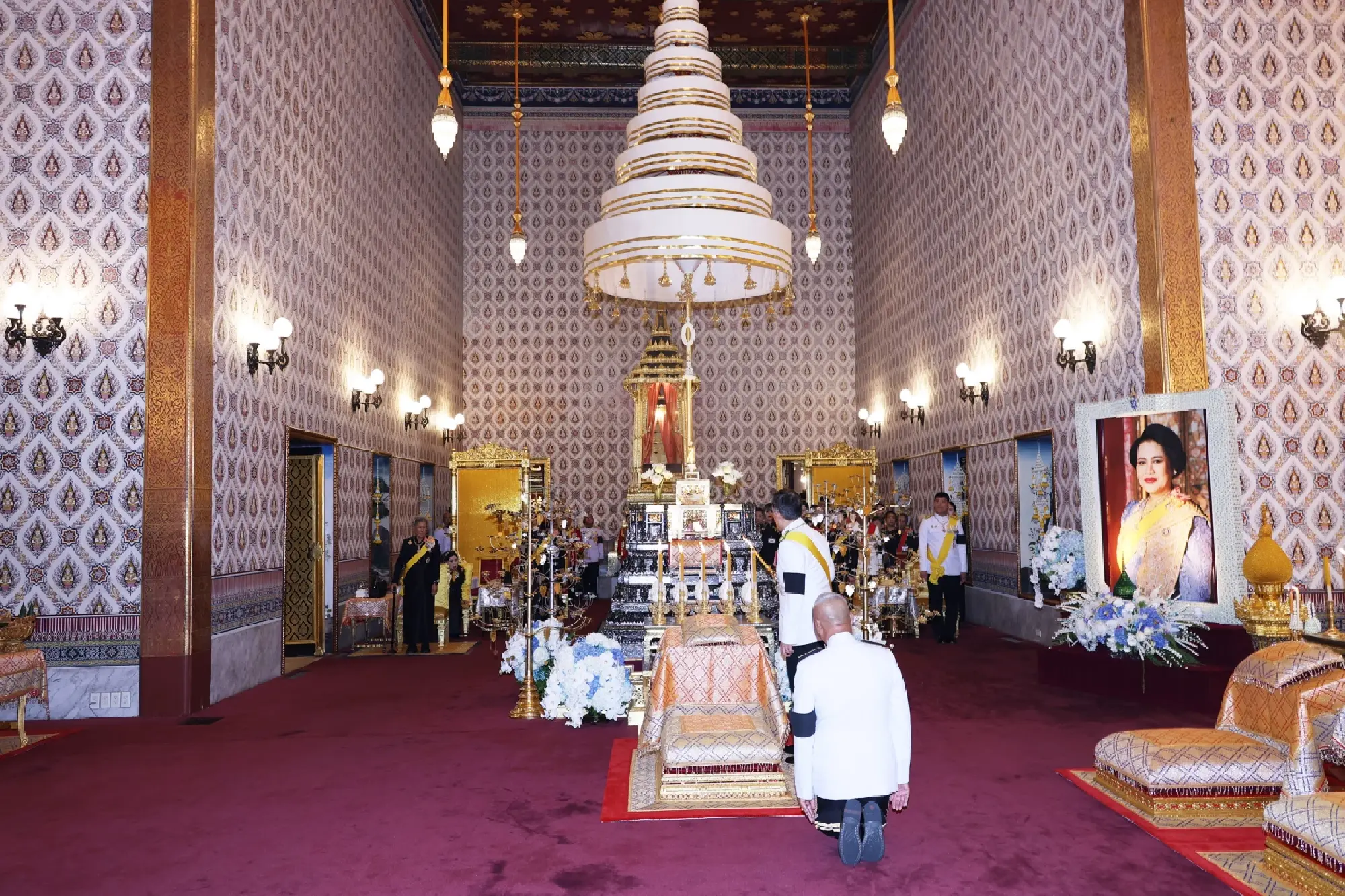 Their Majesties perform royal bathing rites for Queen Sirikit, the Queen Mother