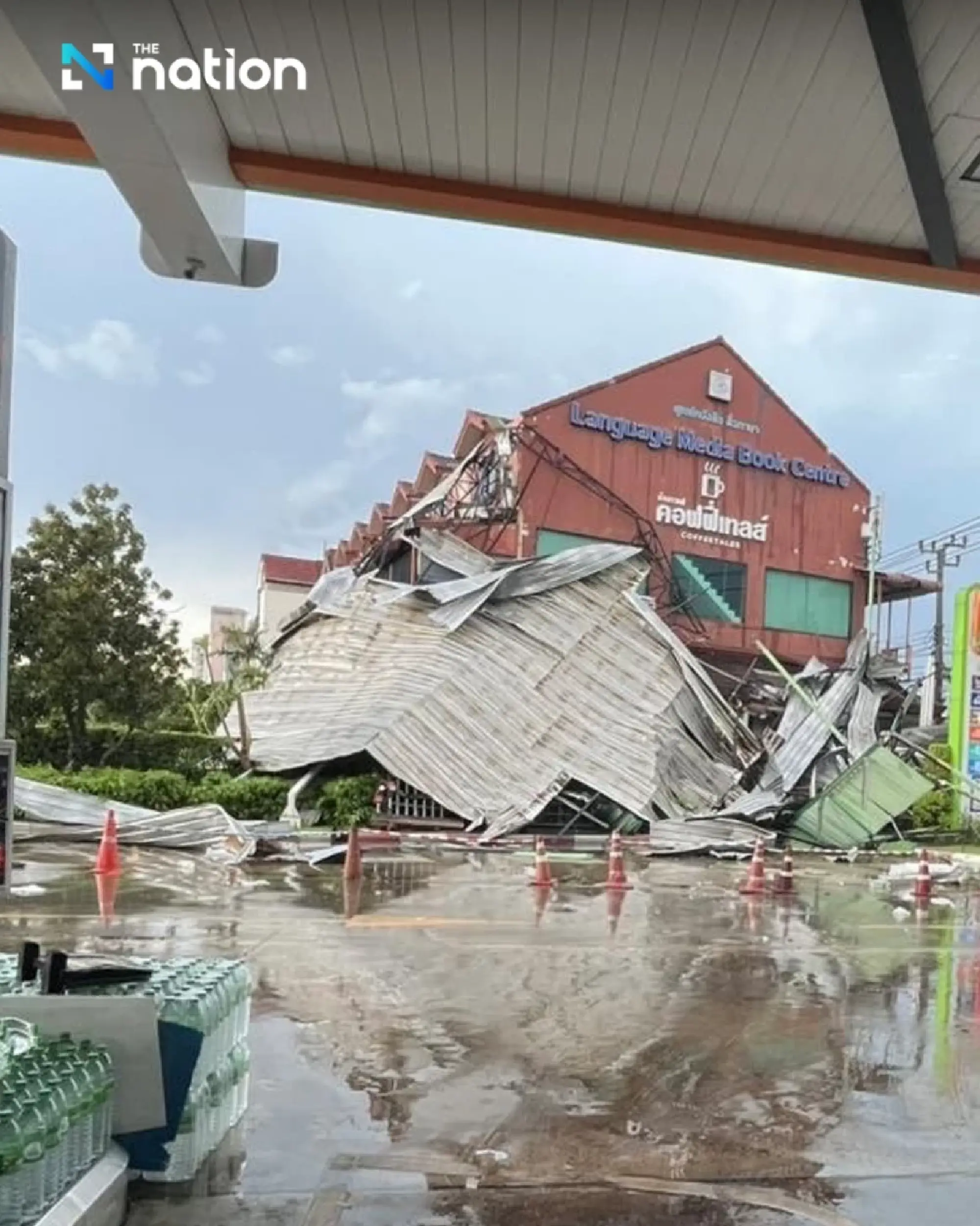 Heavy rain and strong winds cause flooding and fallen trees across Bangkok, disrupting traffic
