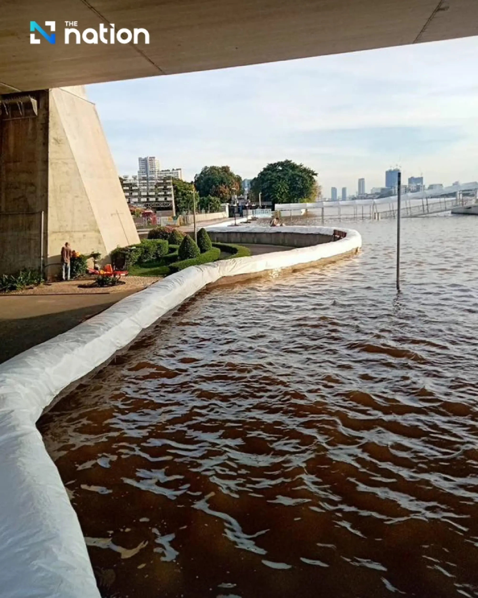 Authorities warn of high tides as Chao Phraya River overflows riverside walkway