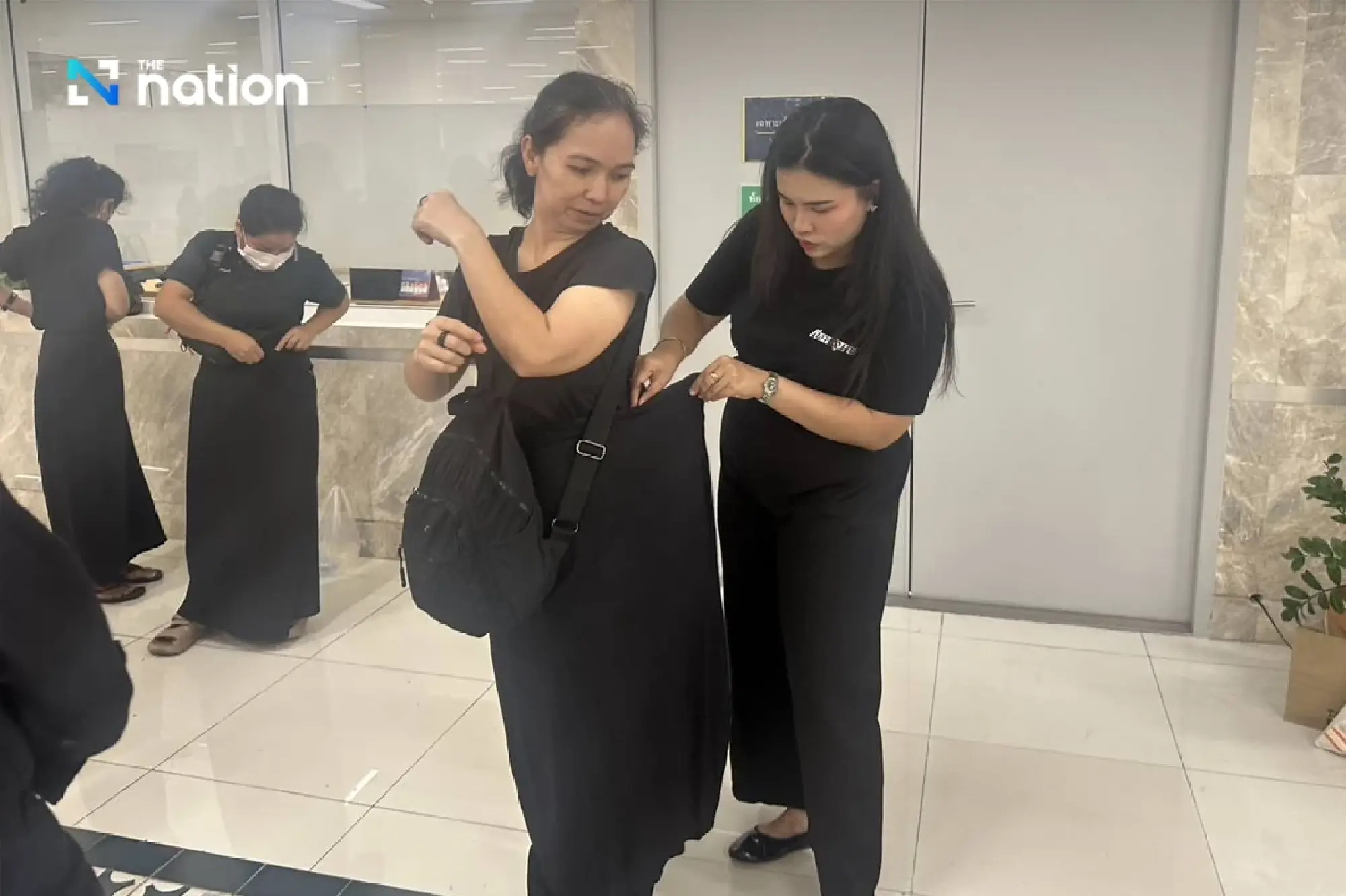 Free skirt rentals for mourners paying respects to the Queen Mother