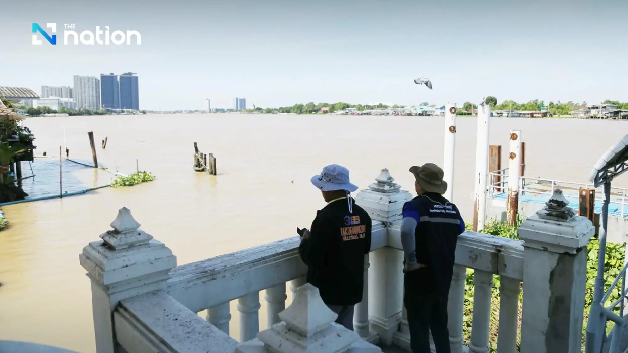 Authorities warn of high tides as Chao Phraya River overflows riverside walkway
