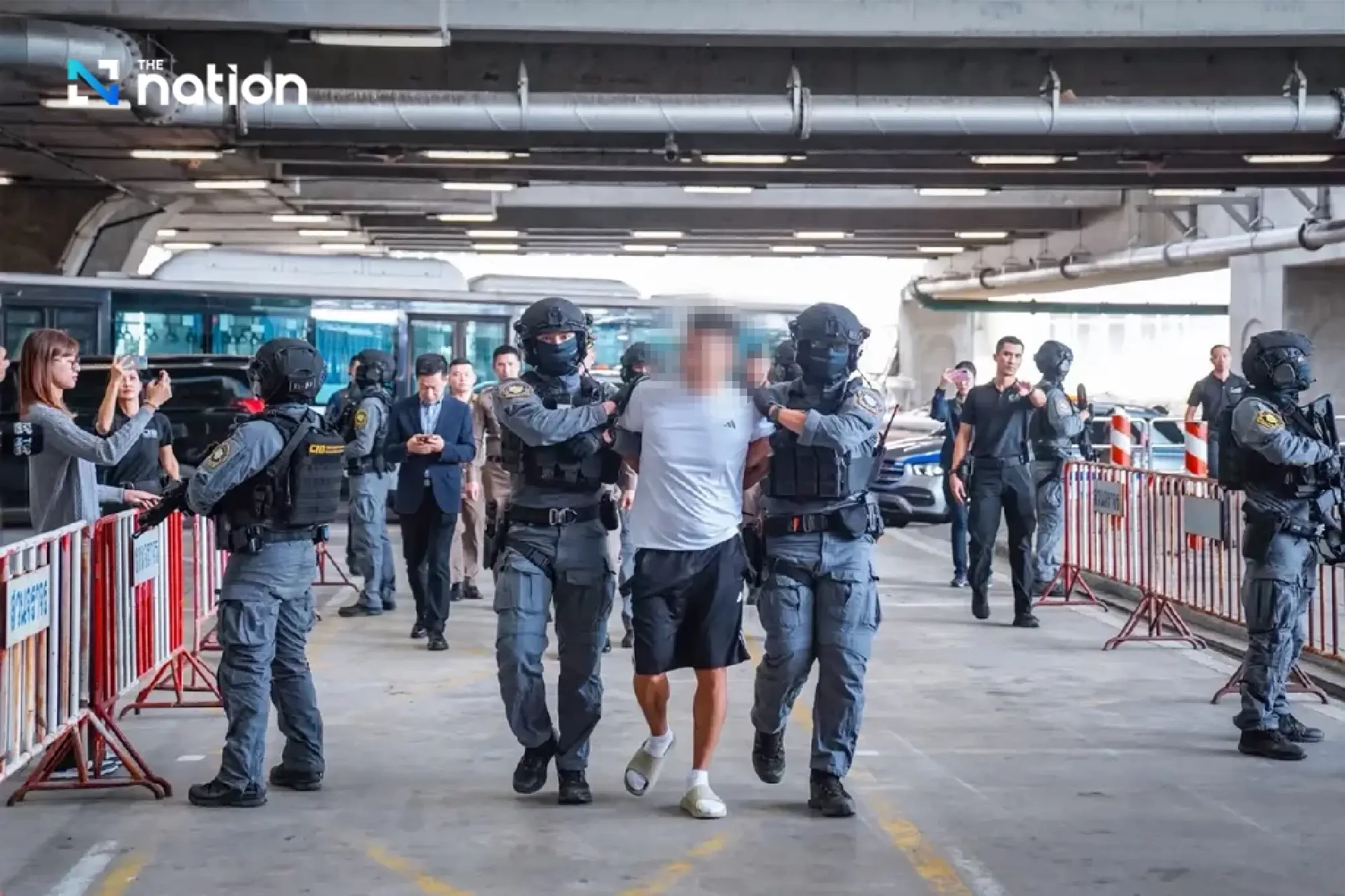 CIB commando team hands over She Zhijiang to Chinese police