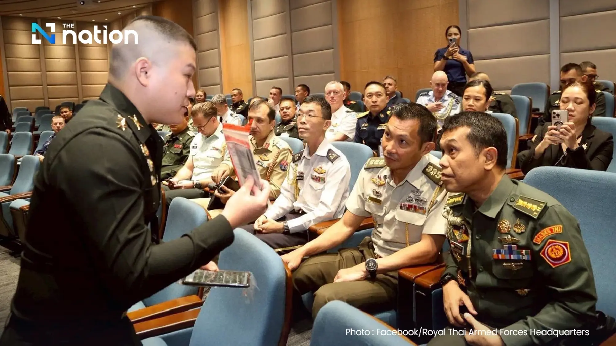 Thai Armed Forces present seized Cambodian soldier’s mobile phone to foreign defence attachés as evidence