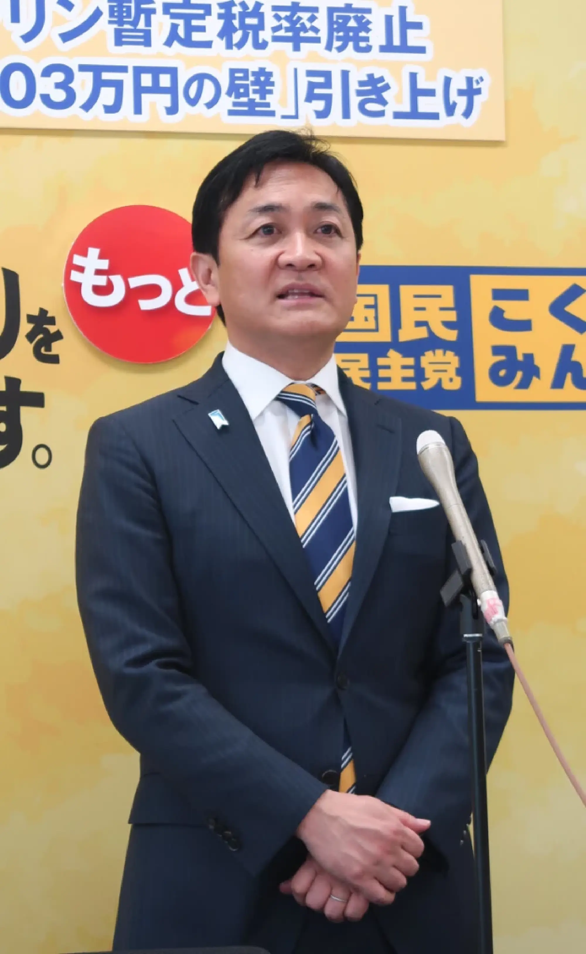 Democratic Party for the People leader Yuichiro Tamaki speaks to reporters in parliament Friday.