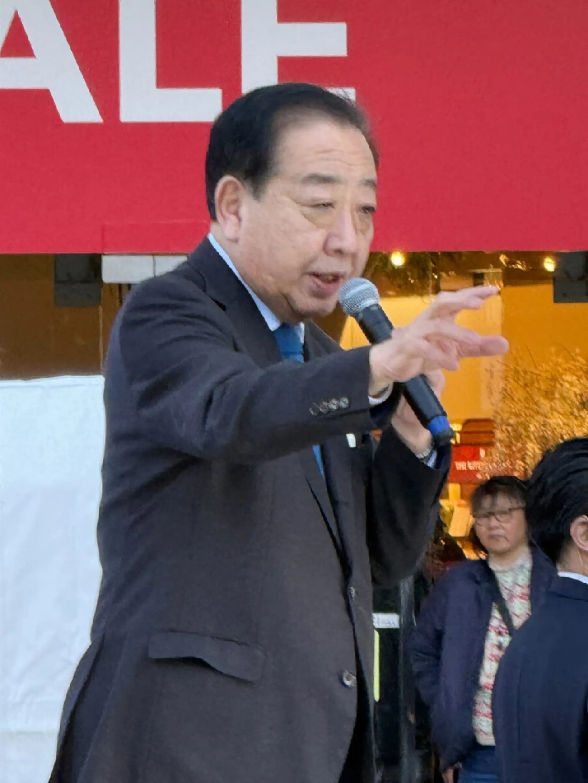 Centrist Reform Alliance co-leader Yoshihiko Noda delivers a street speech in Tokyo on Friday.