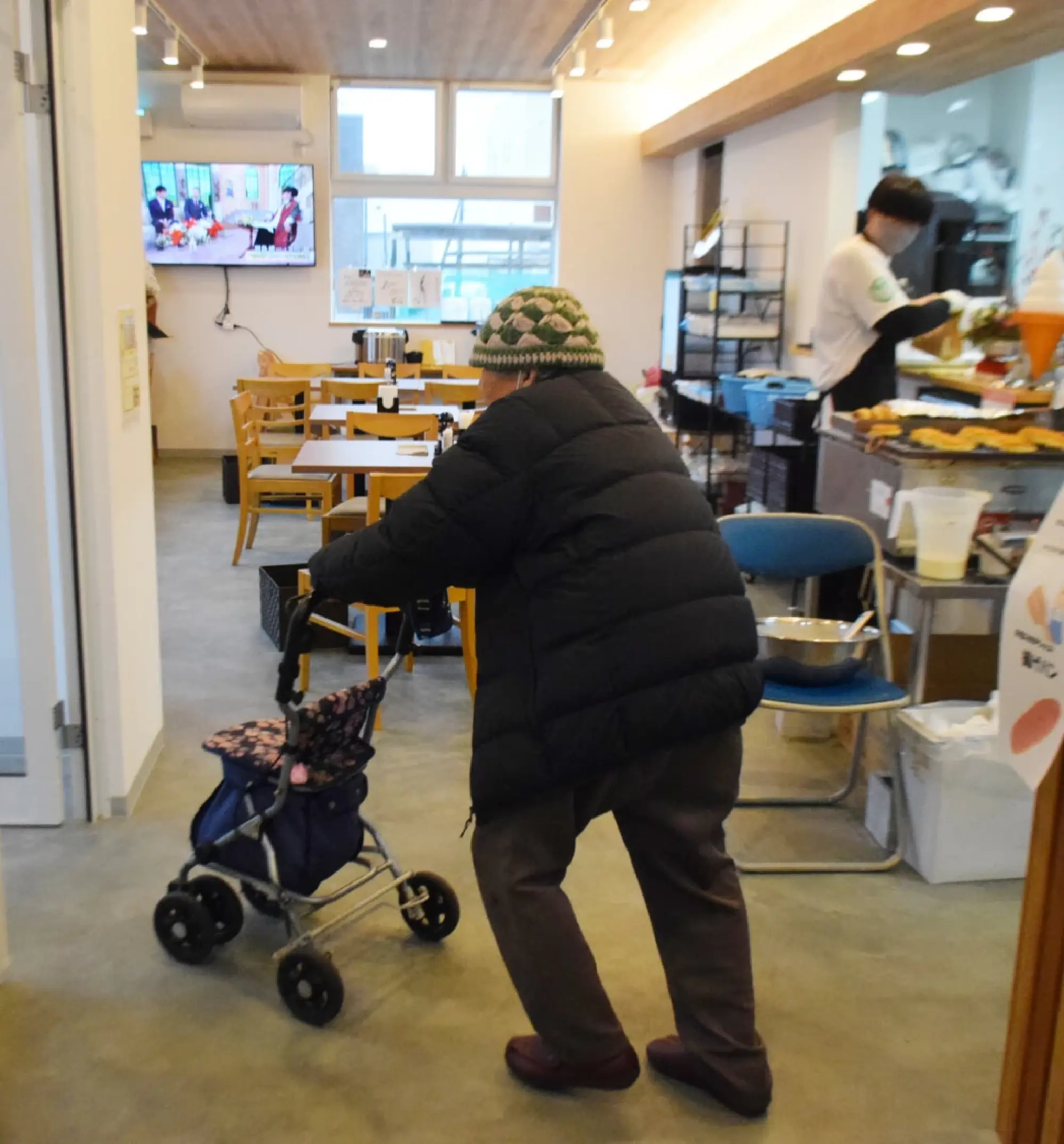 Ryoko Kurosugi, a resident of the Toge district in the city of Wajima, Ishikawa Prefecture, central Japan, visits Toge Marche, a cafeteria and supermarket, on Dec. 24, 2025, a month after the store was opened to support people affected by the Jan. 1, 2024, Noto Peninsula earthquake.