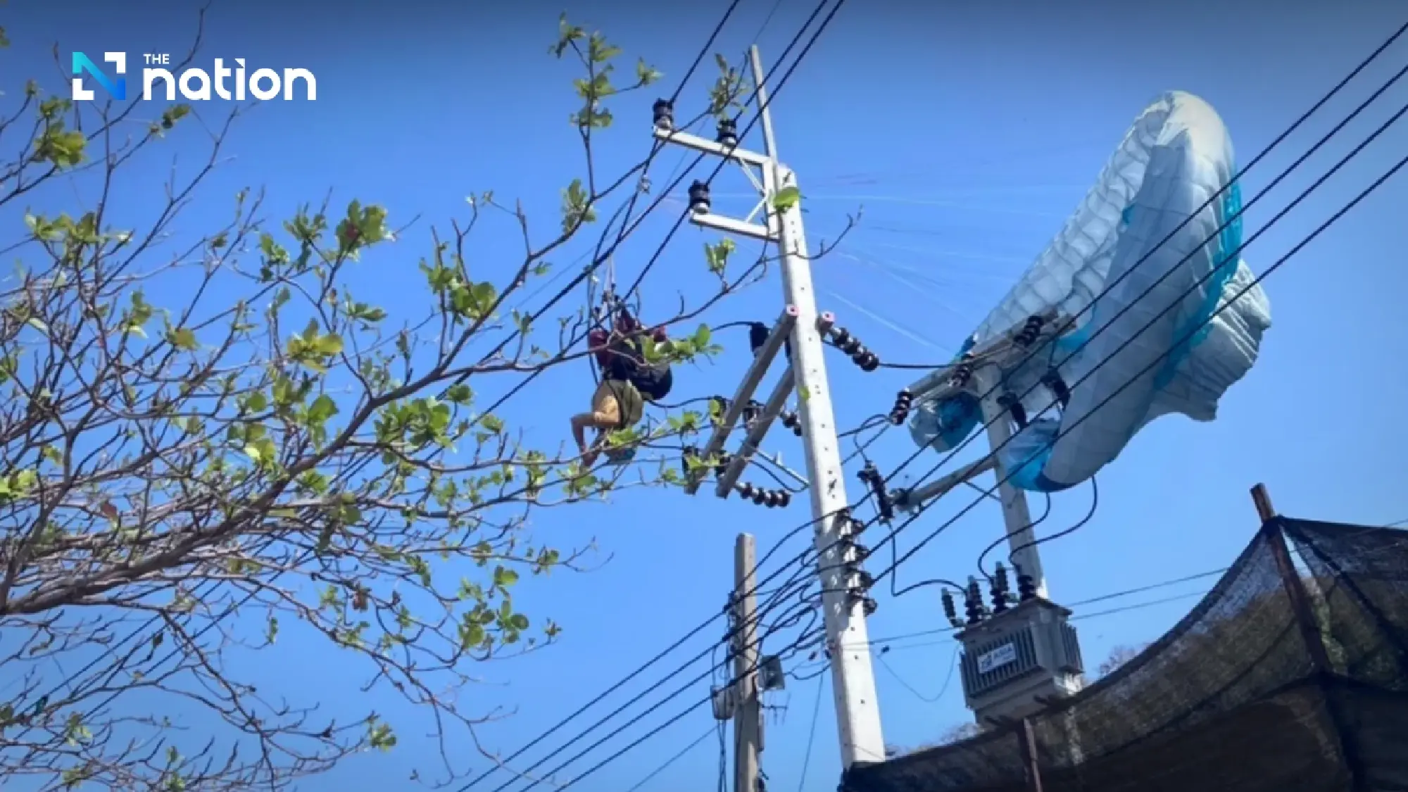 Paraglider caught on high-voltage pole forces Koh Larn power cut