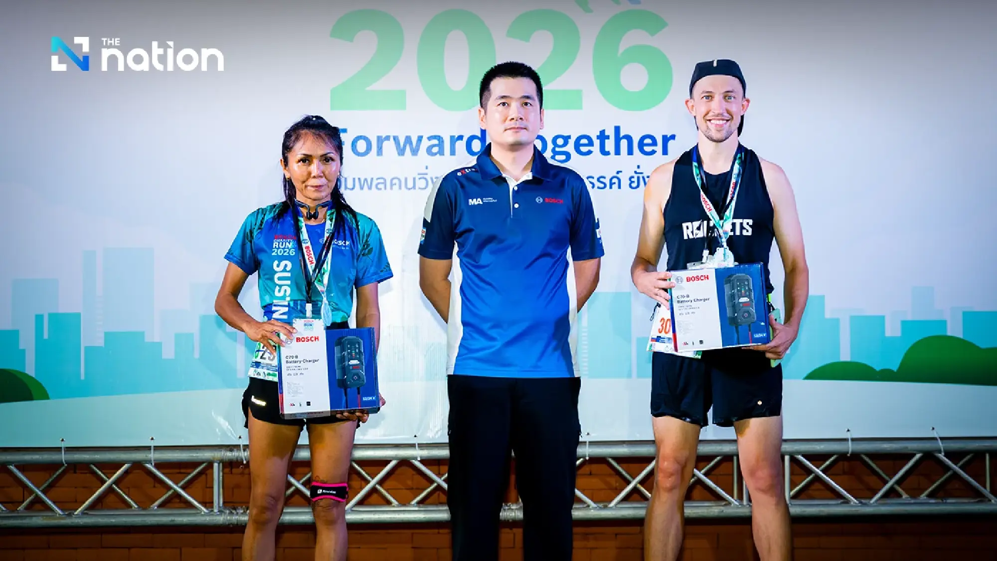 Piyapan Tawatsupa, Country Head of Mobility Aftermarket, presents battery chargers to the first runner-up participants.