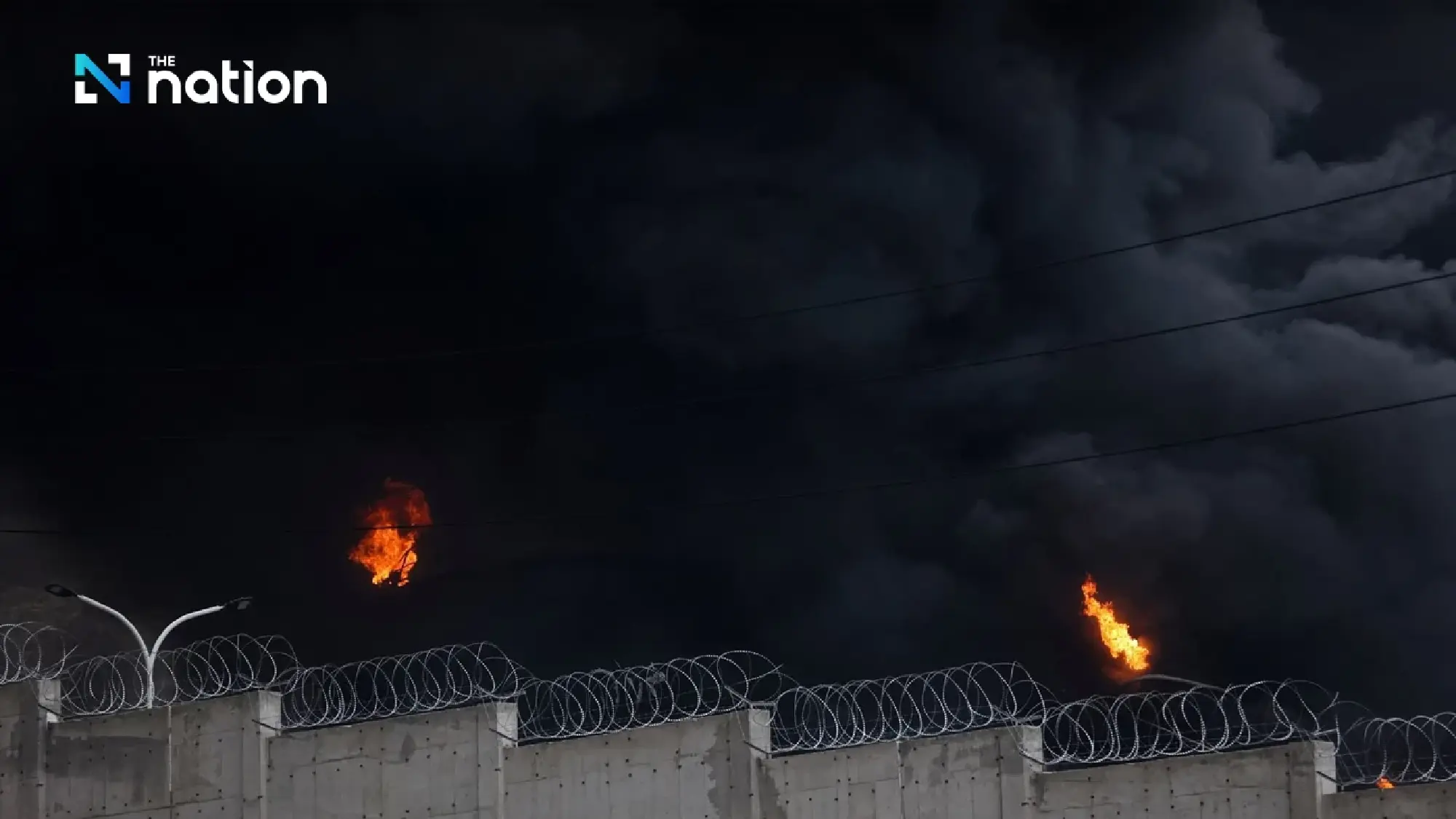 Black acid rain hits Iran after oil depot blasts, harming health and environment