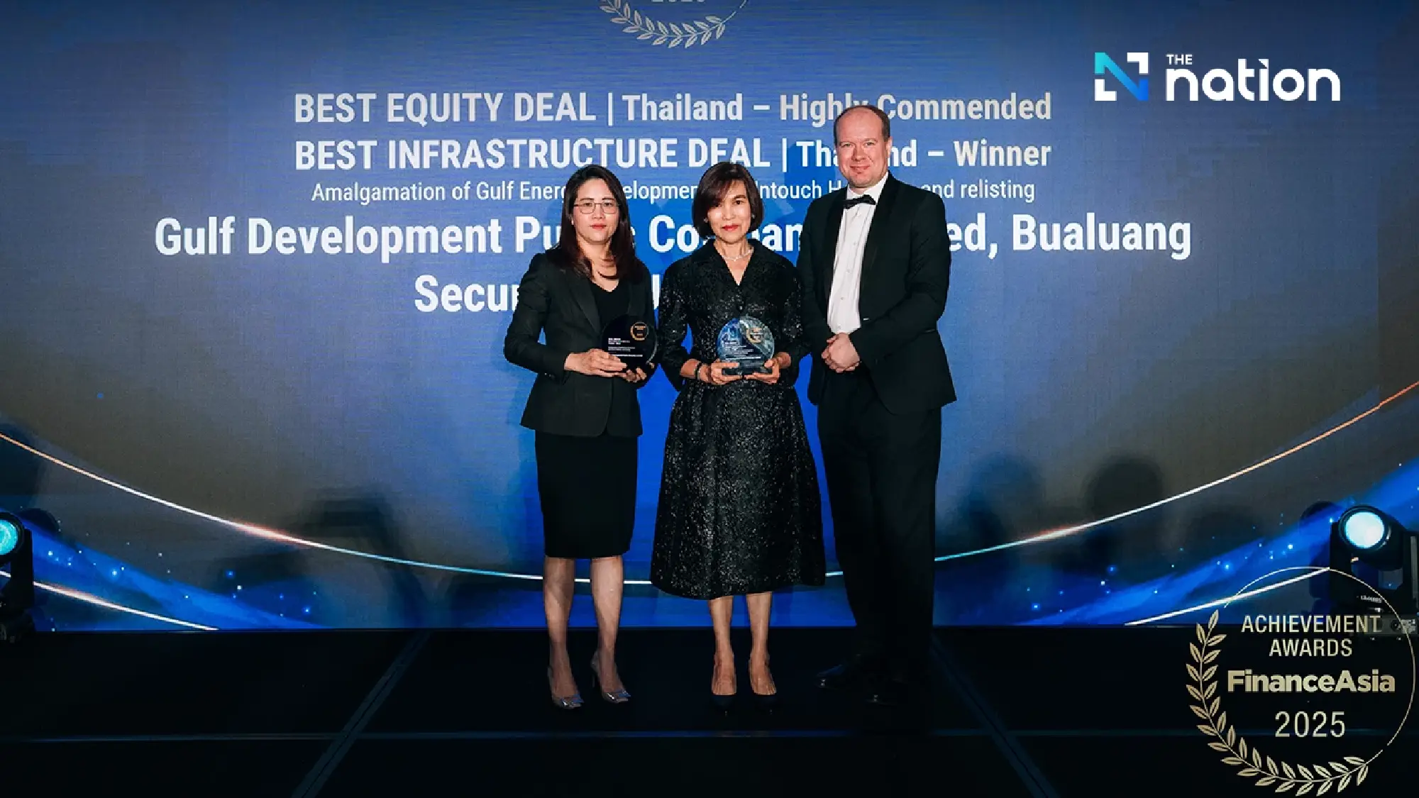 Best Infrastructure Deal – Thailand, accepted by Ms. Bung-on Suttipattanakit (Center), Executive Director, and Ms. Sittinard Tangtrongchitt (left), Chief Corporate Planning Officer,  Gulf Development Public Company Limited (GULF)