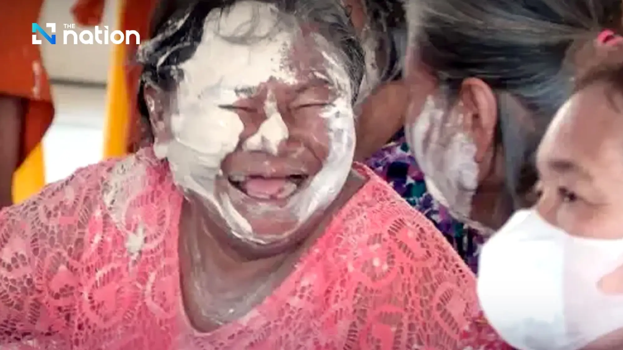 Surin monks covered in white powder during Songkran rite