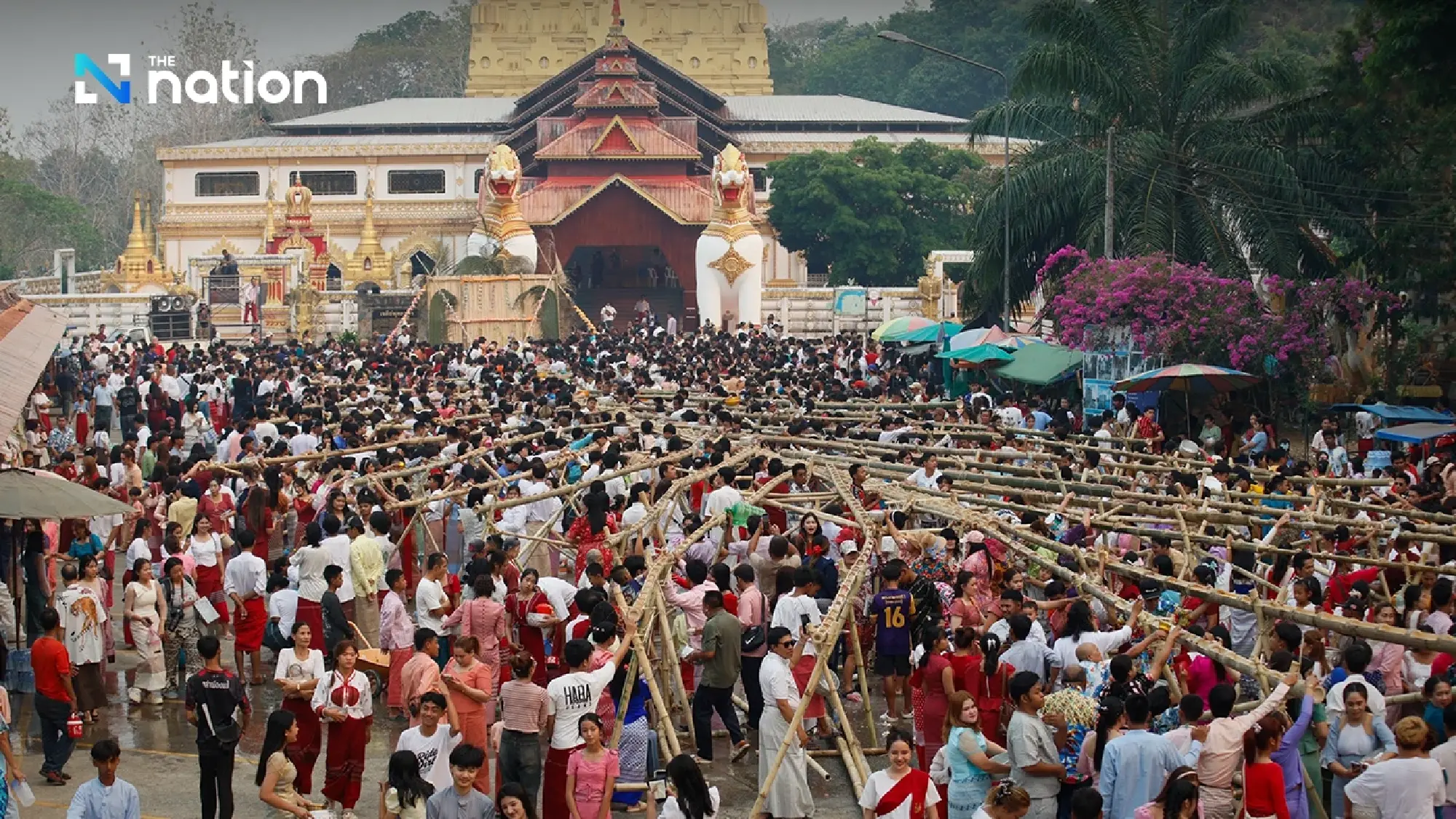 One of a kind tradition: Mon Songkran rite bathes monks through bamboo channels