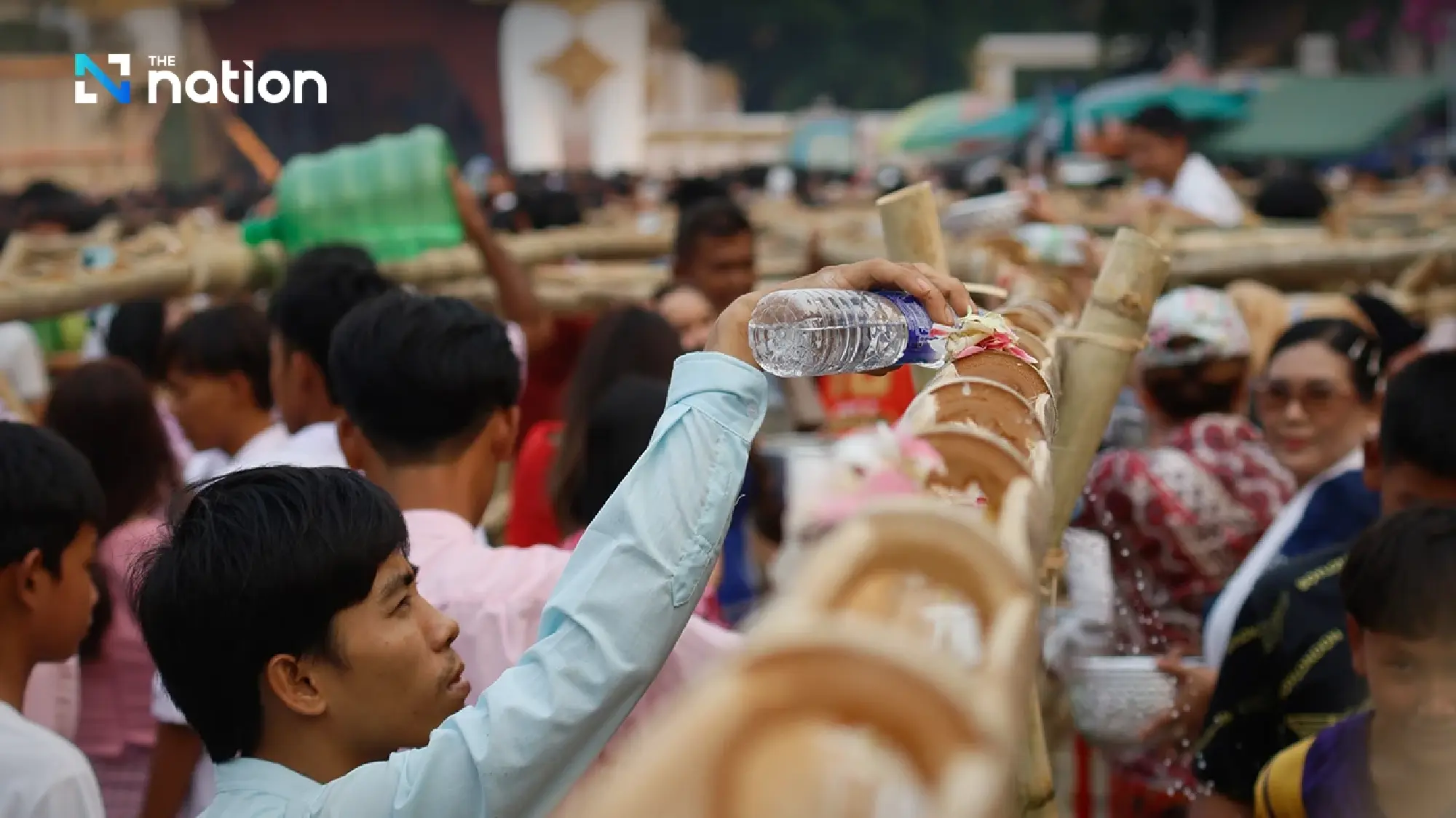 One of a kind tradition: Mon Songkran rite bathes monks through bamboo channels
