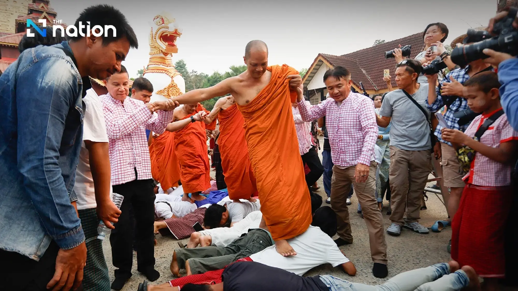One of a kind tradition: Mon Songkran rite bathes monks through bamboo channels