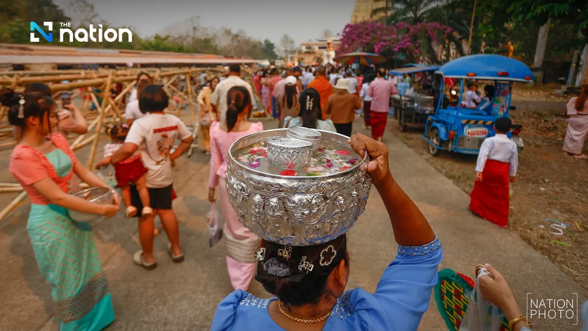 One of a kind tradition: Mon Songkran rite bathes monks through bamboo channels