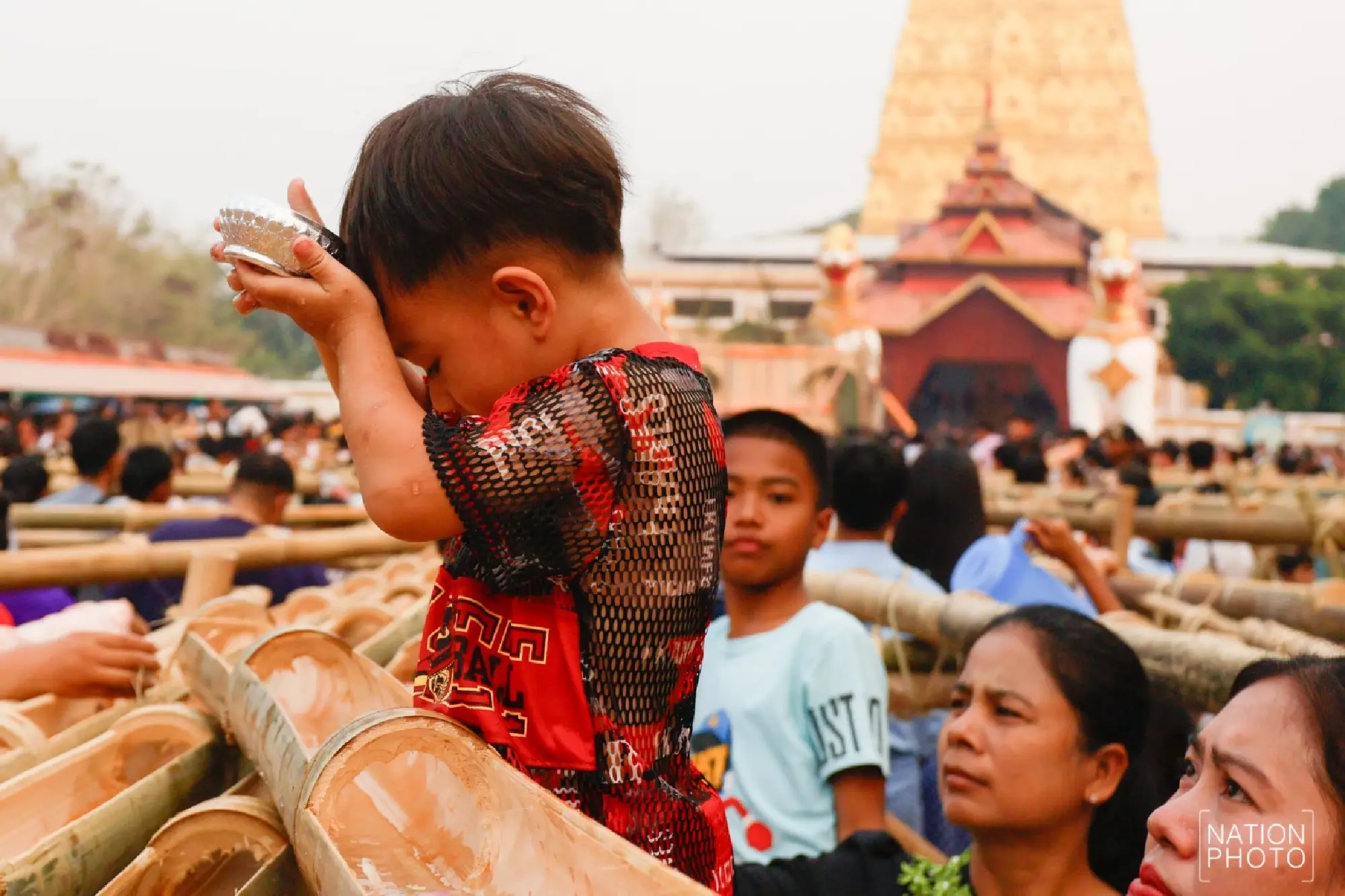 One of a kind: Mon Songkran rite bathes monks through bamboo channels