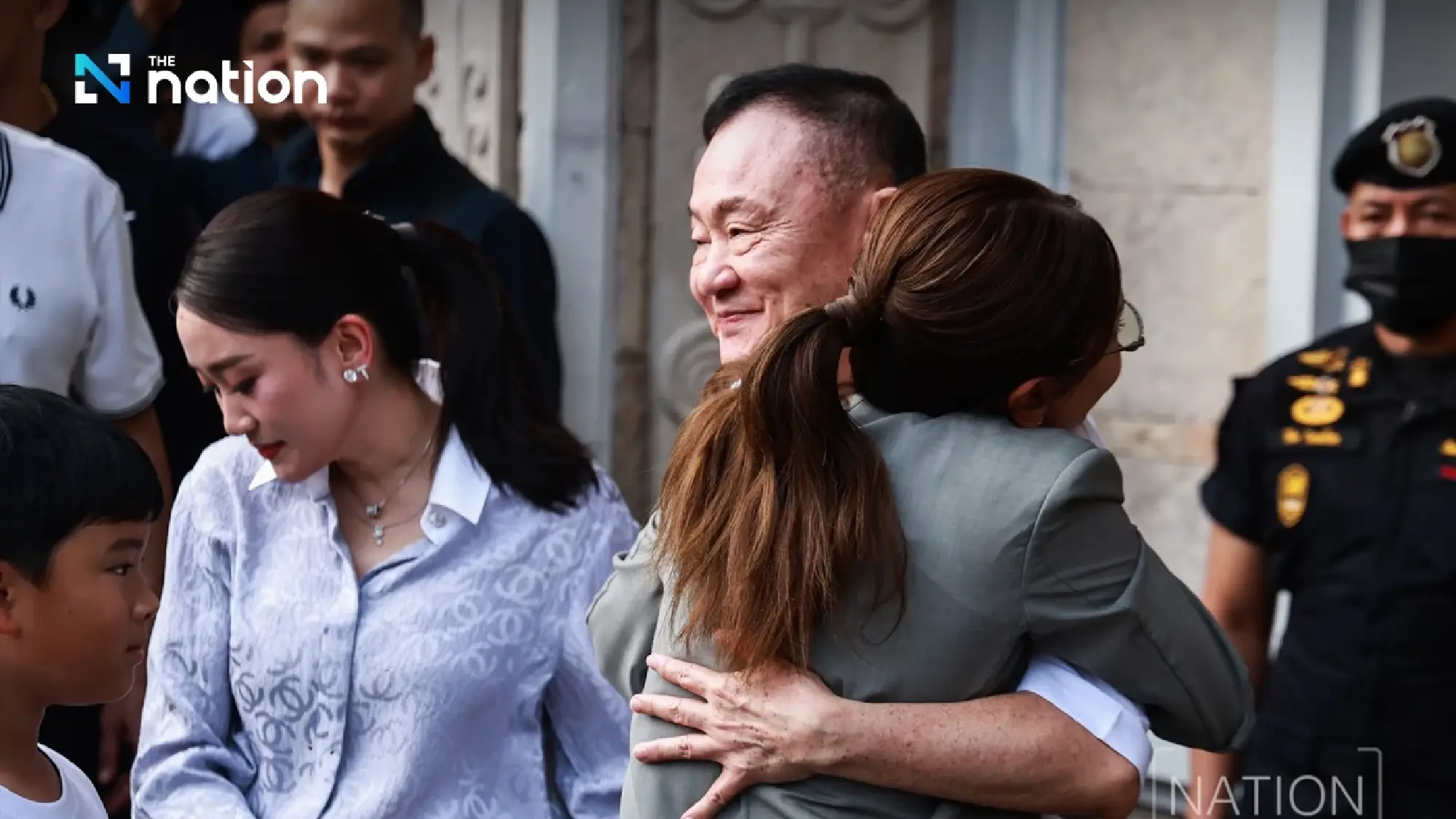 Thaksin walks free to cheers from family and red shirts