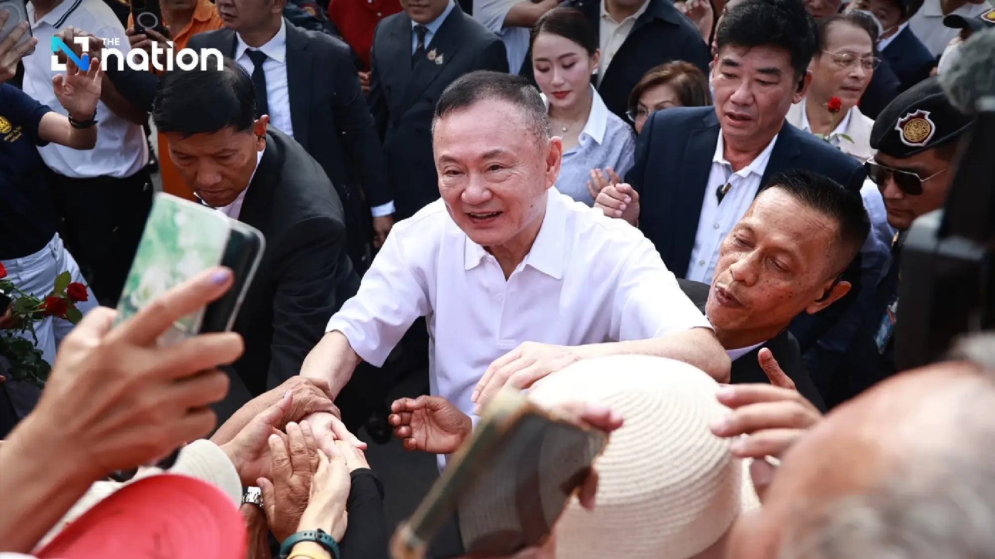 Thaksin walks free to cheers from family and red shirts