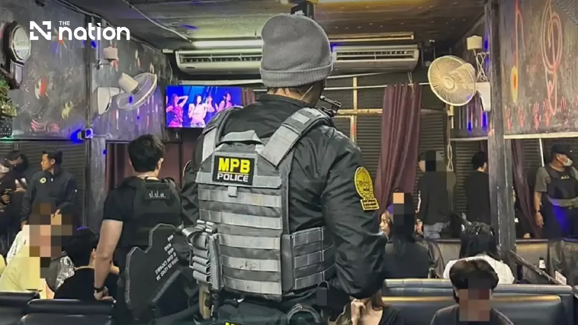 Police raid secret Huai Khwang pub disguised as game shop, find drugs and no fire exit