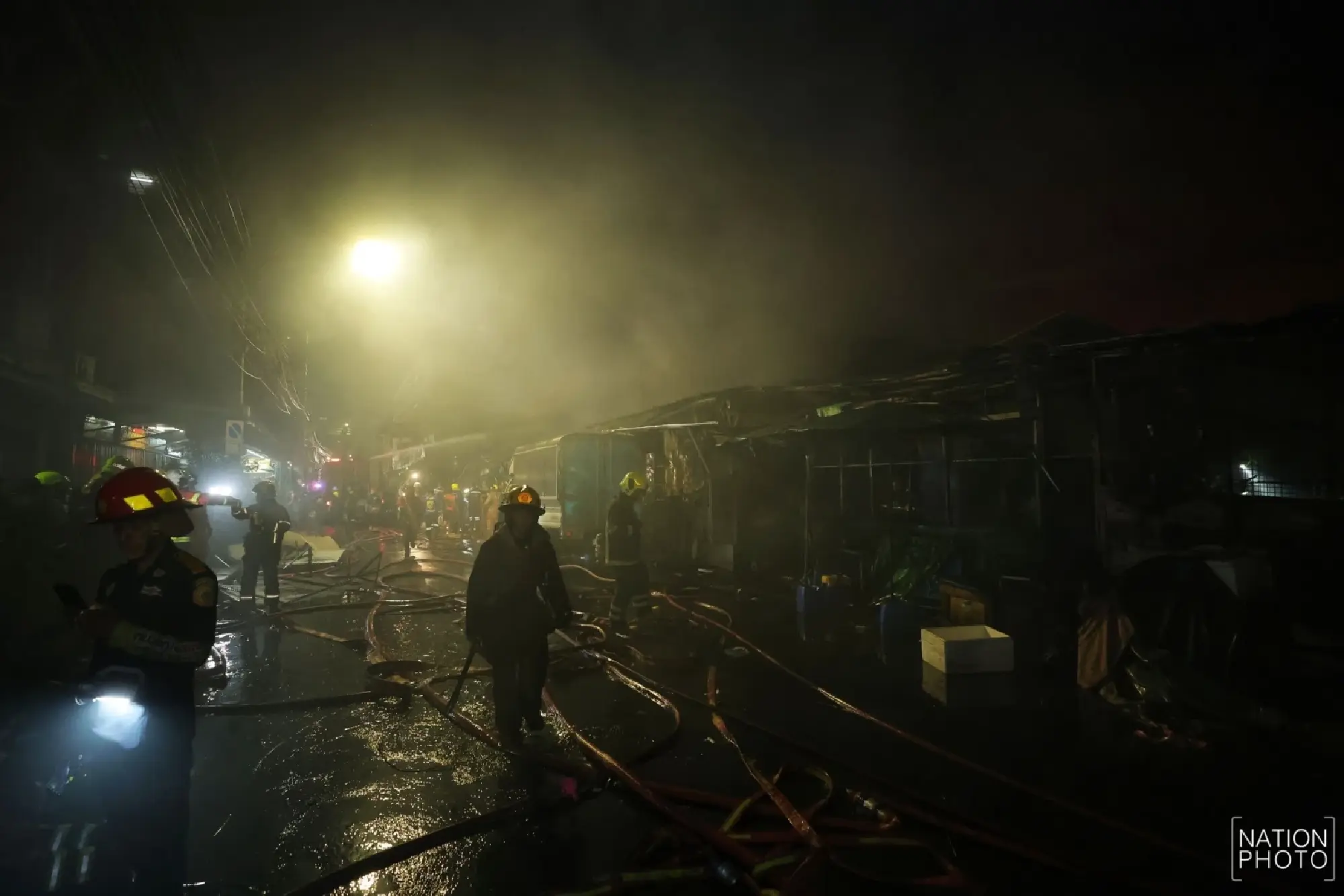 Khlong Thom roof subsides as crews fight fire from outside
