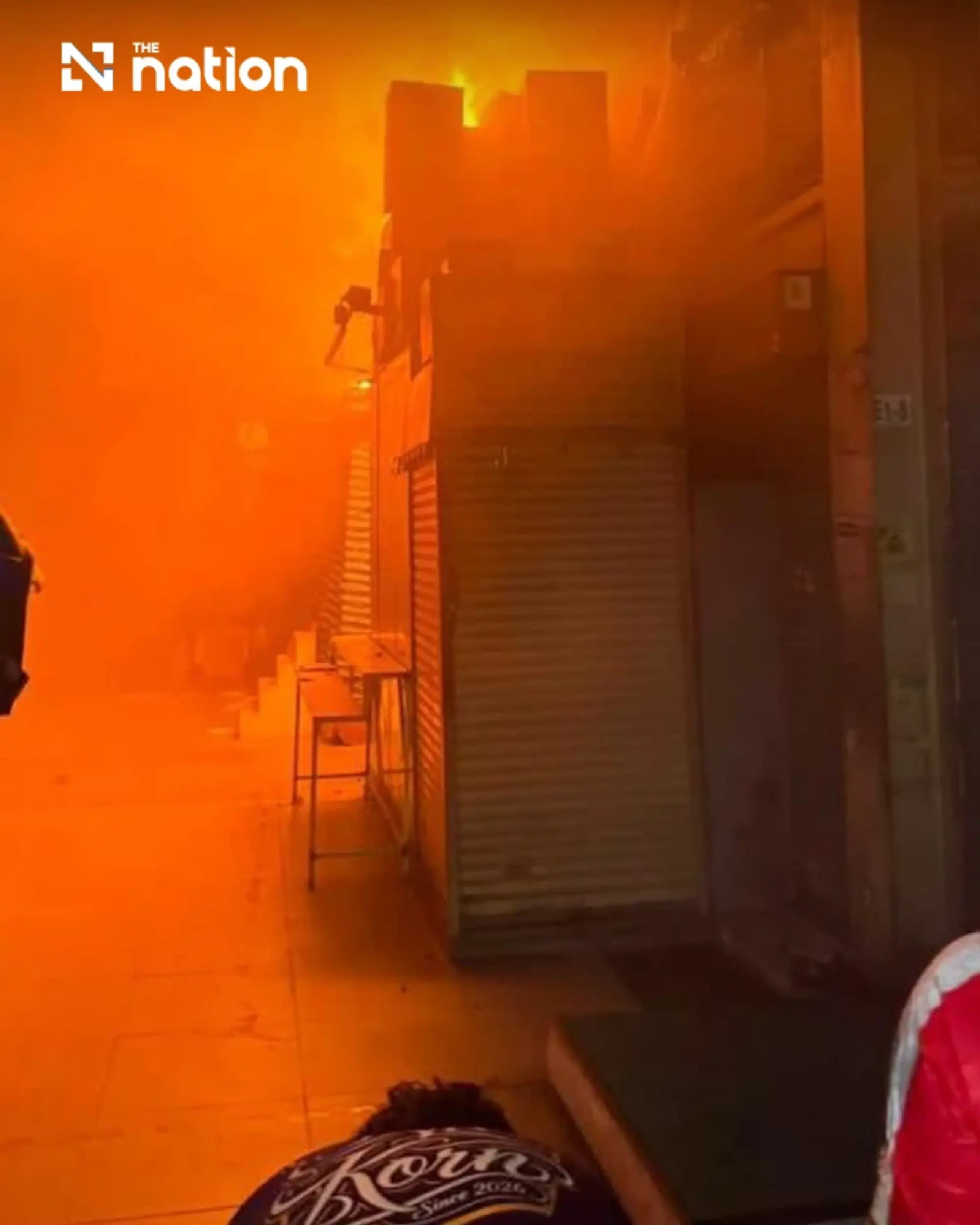 Khlong Thom roof subsides as crews fight fire from outside