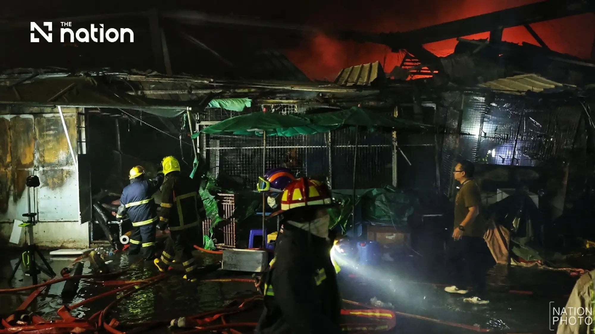 Khlong Thom roof subsides as crews fight fire from outside