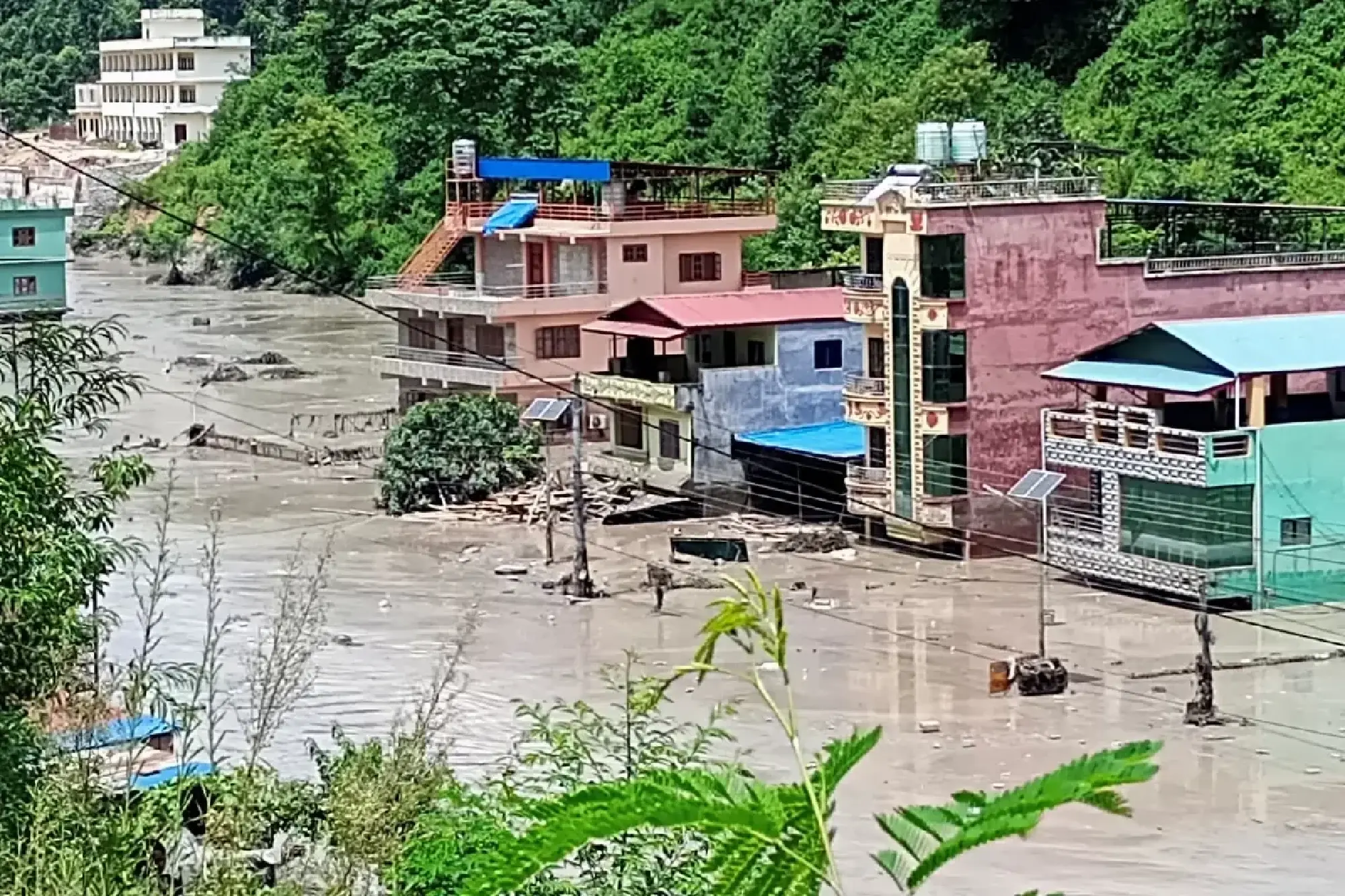 At least 160 killed in Nepal-China floods and mudslides, hundreds missing