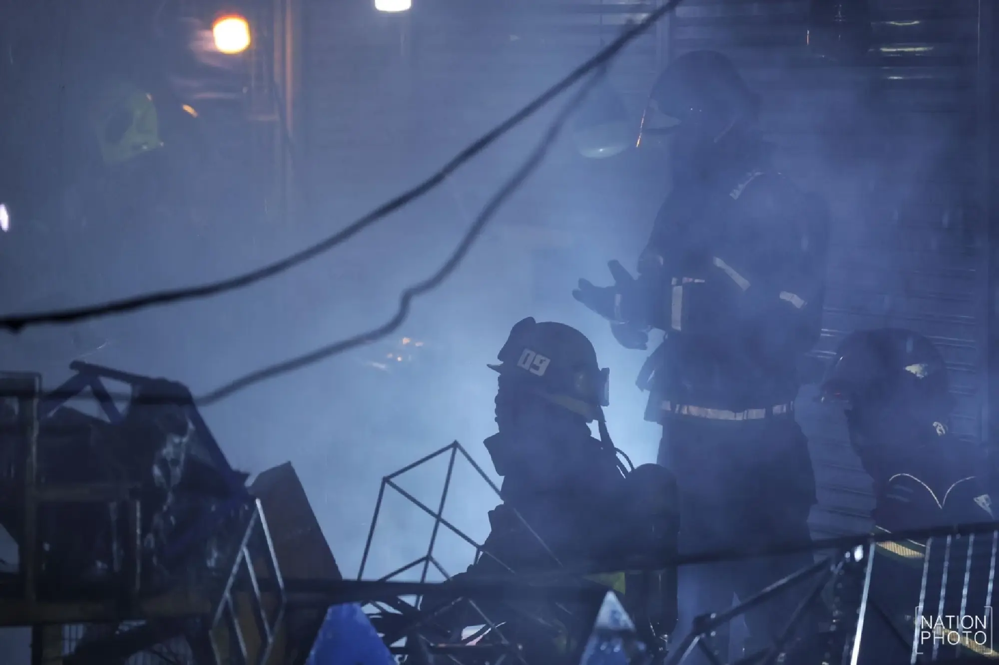 Khlong Thom roof subsides as crews fight fire from outside