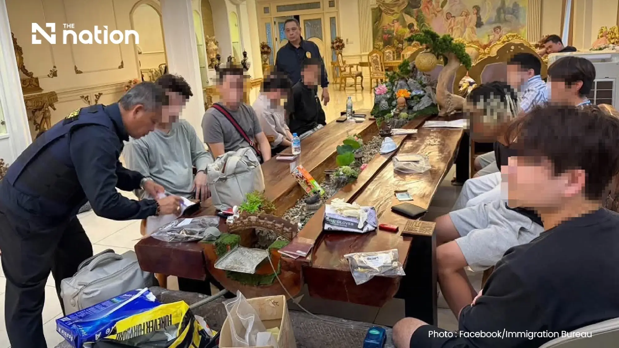 Police detain 14 in scam raid at Bangkok mansion worth over THB270m